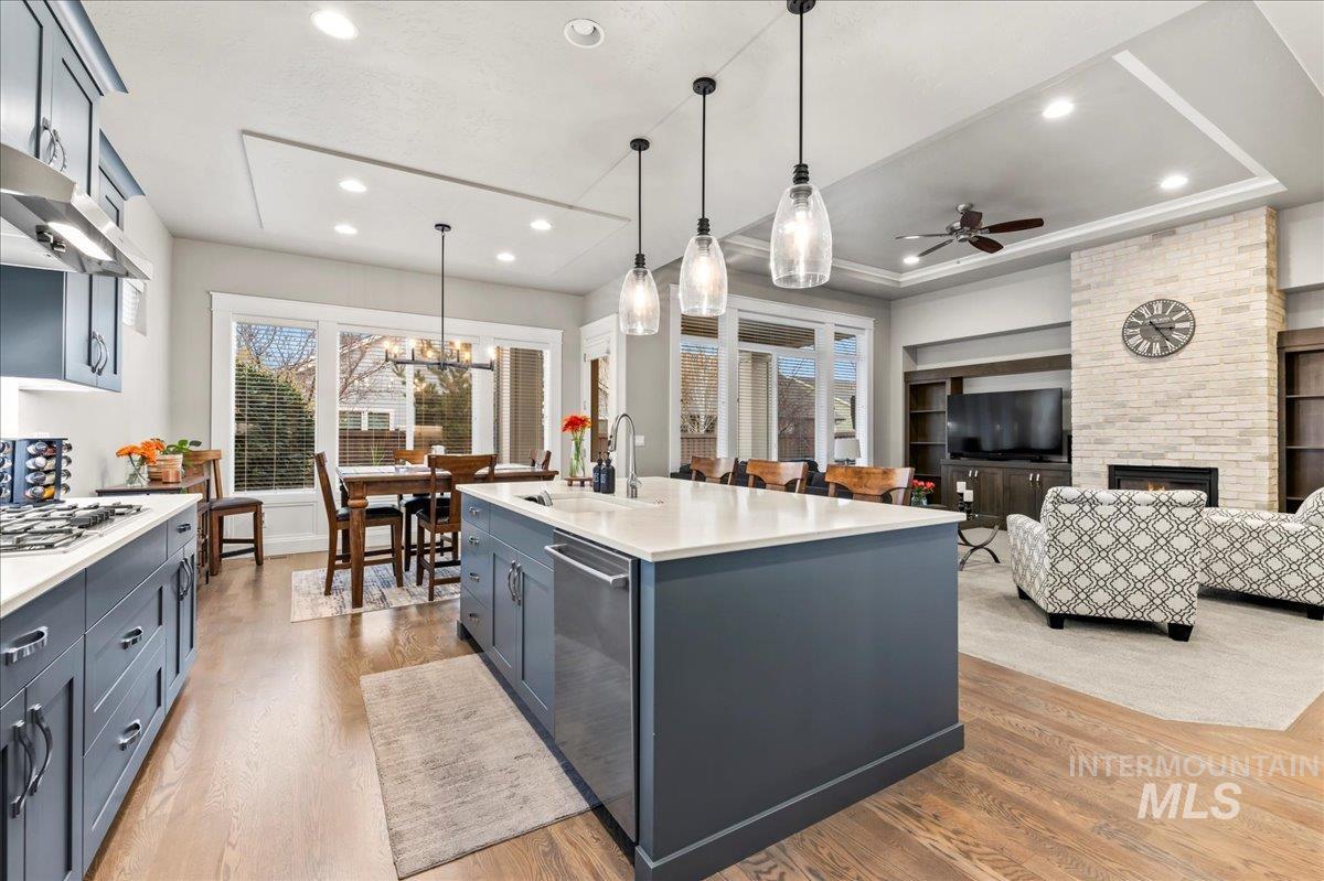 Kitchen featuring pendant lighting, healthy amount of natural light, light wood-style floors, and recessed lighting