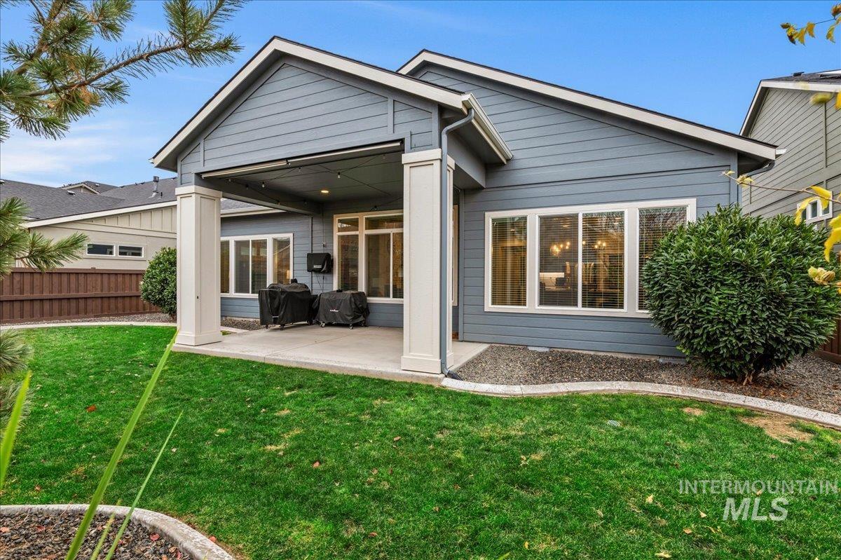 Rear view of property featuring a patio