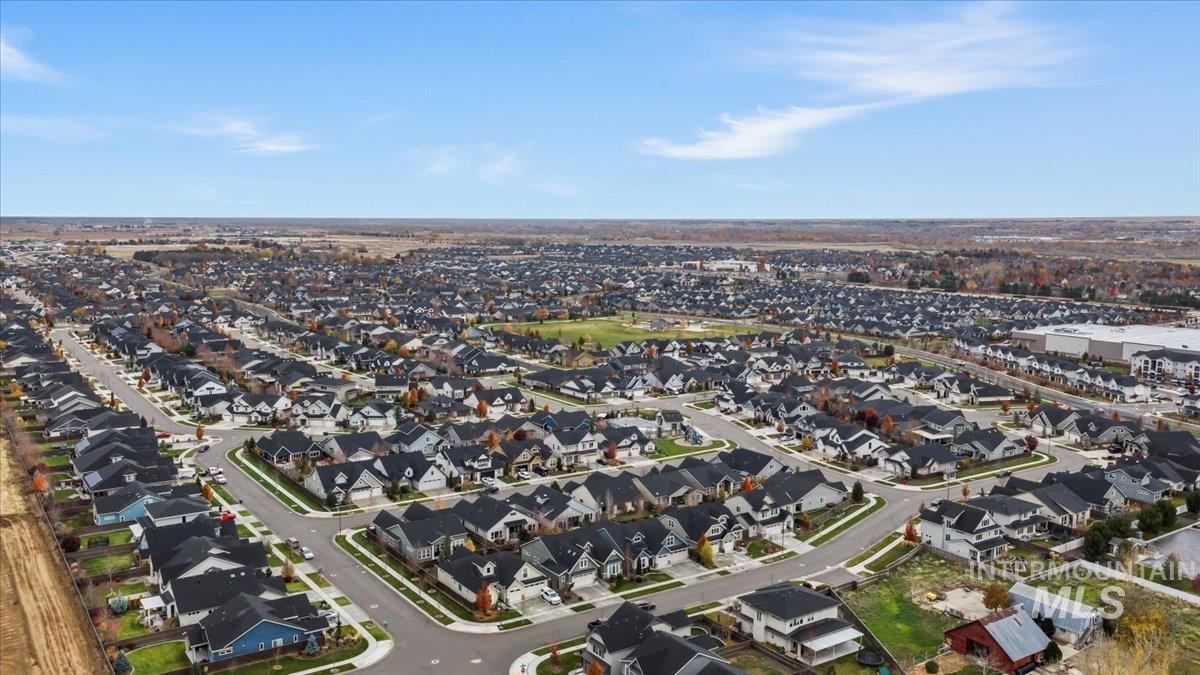 Aerial view of property's location featuring nearby suburban area