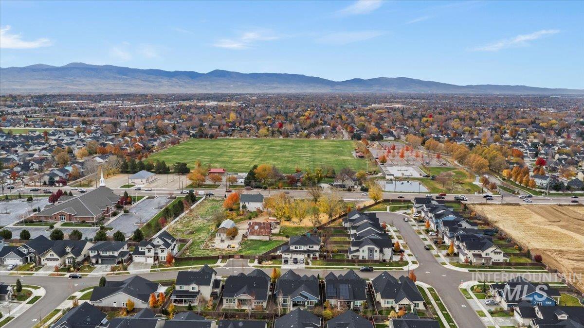 View of property location with nearby suburban area and a mountainous background