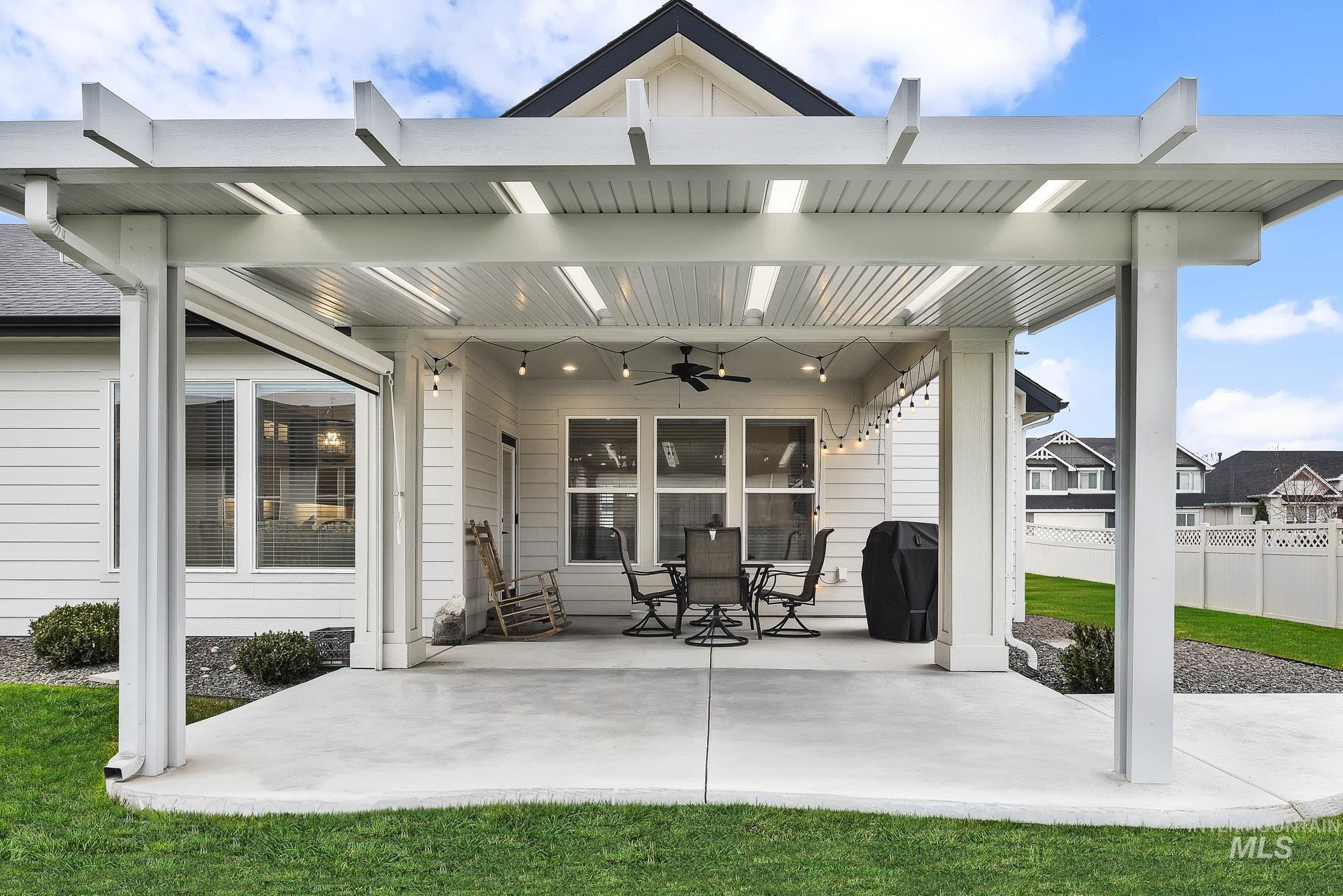 View of patio / terrace with ceiling fan, area for grilling, and outdoor dining space