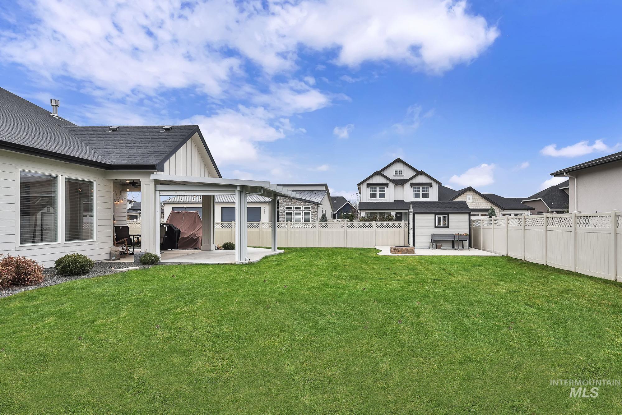 Fenced backyard featuring a patio area