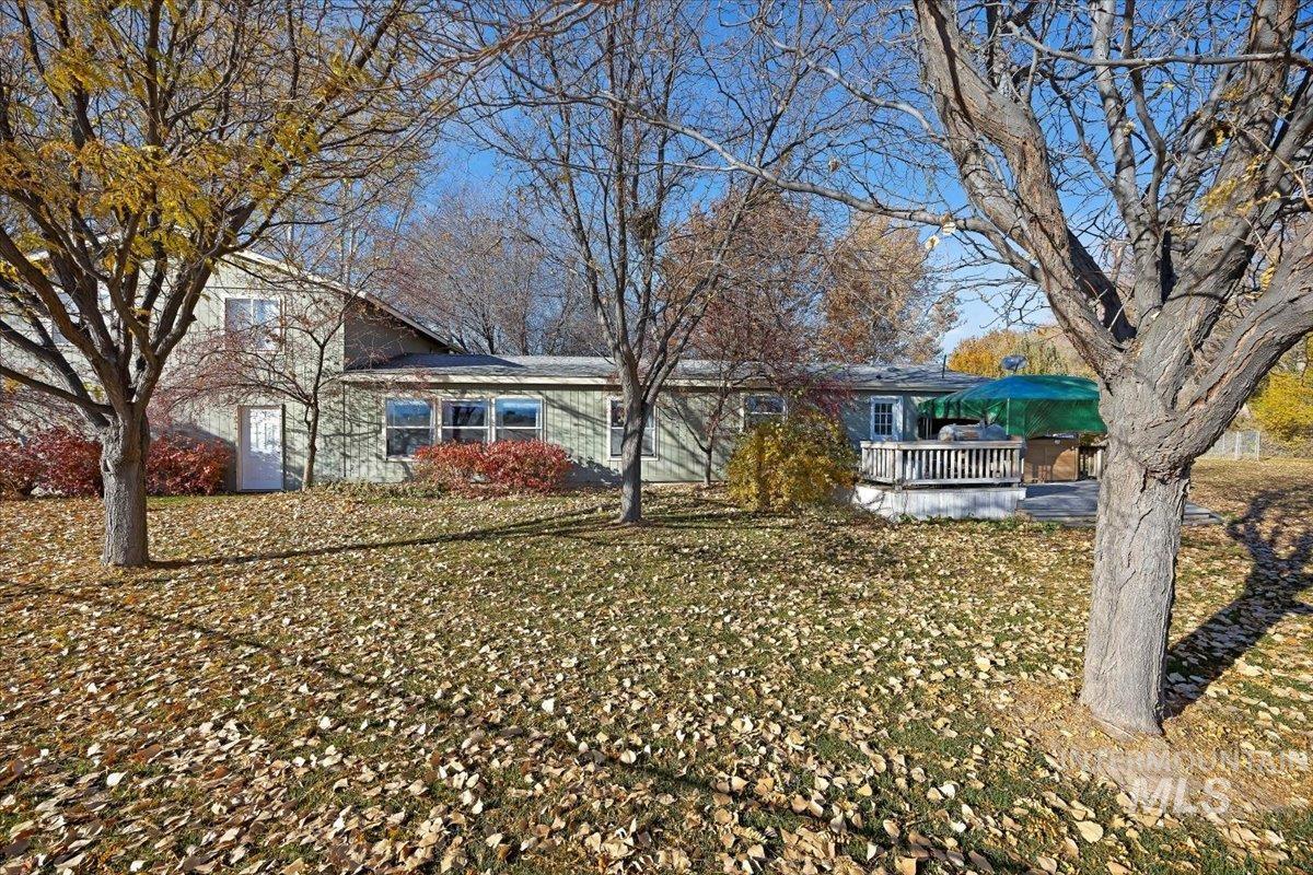 Back of property with a wooden deck