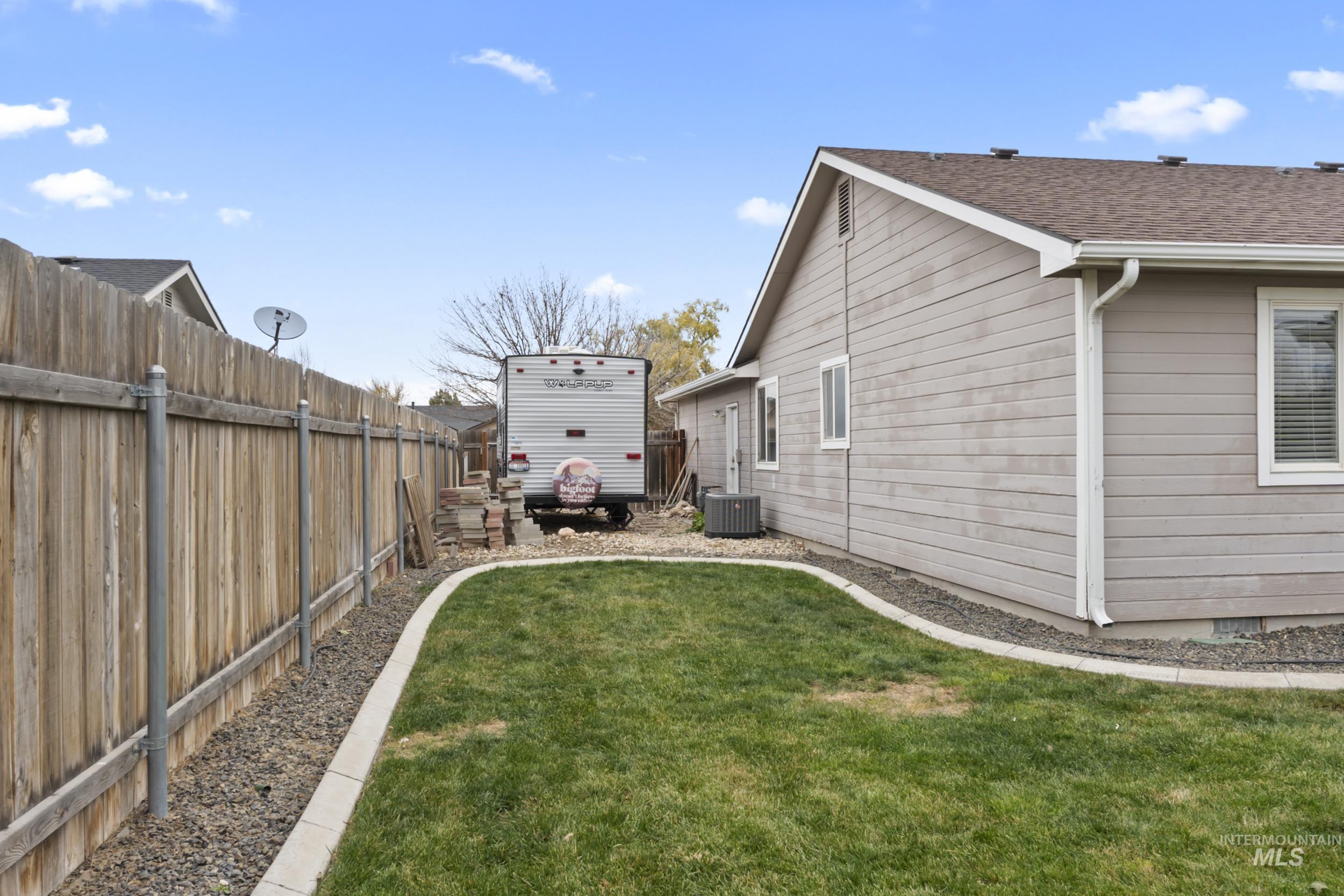 View of fenced backyard