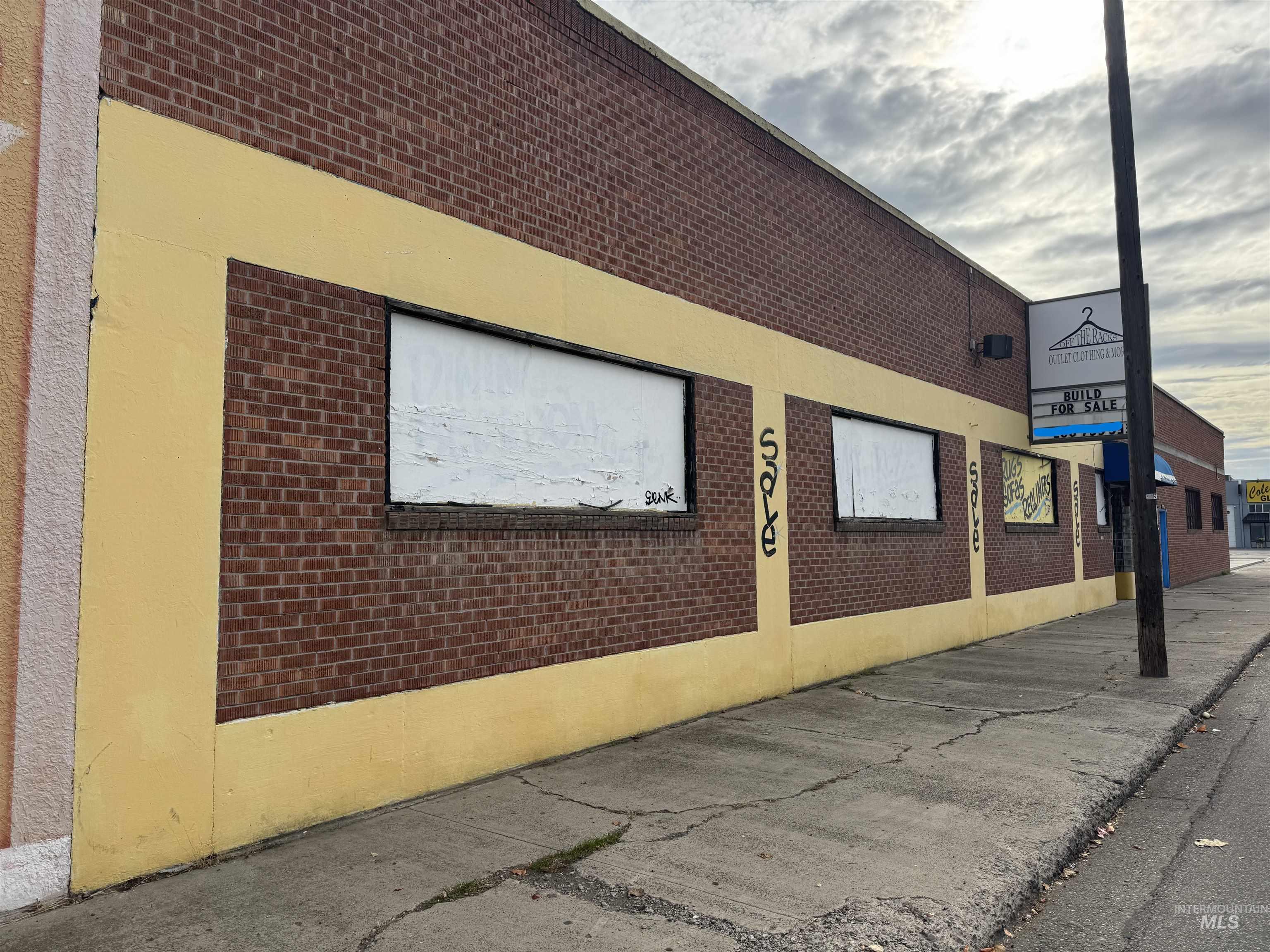 View of property exterior with brick siding