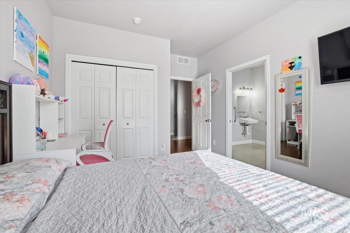 Bedroom with a closet and baseboards