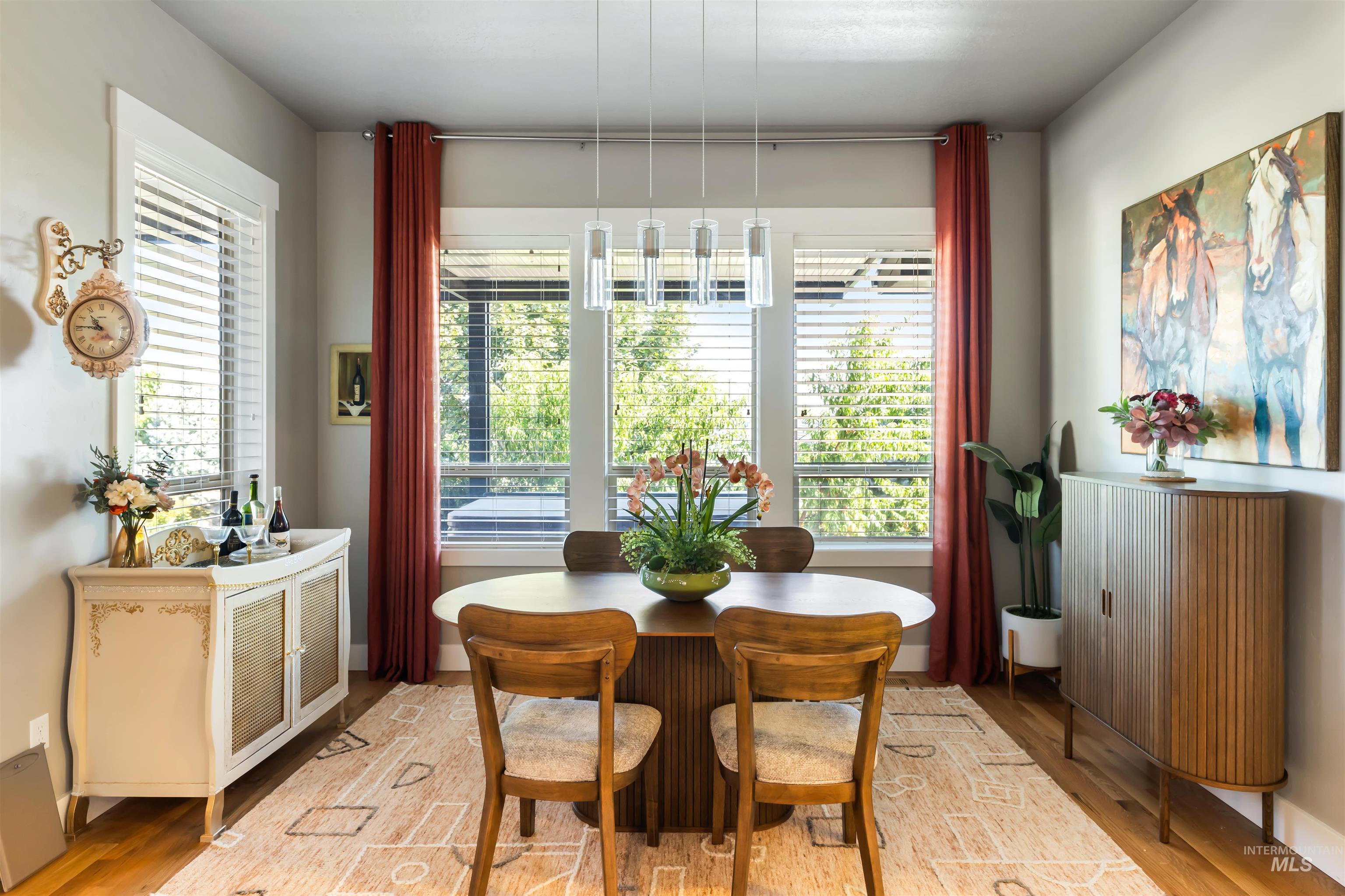 Dining space with plenty of natural light and light wood-style flooring