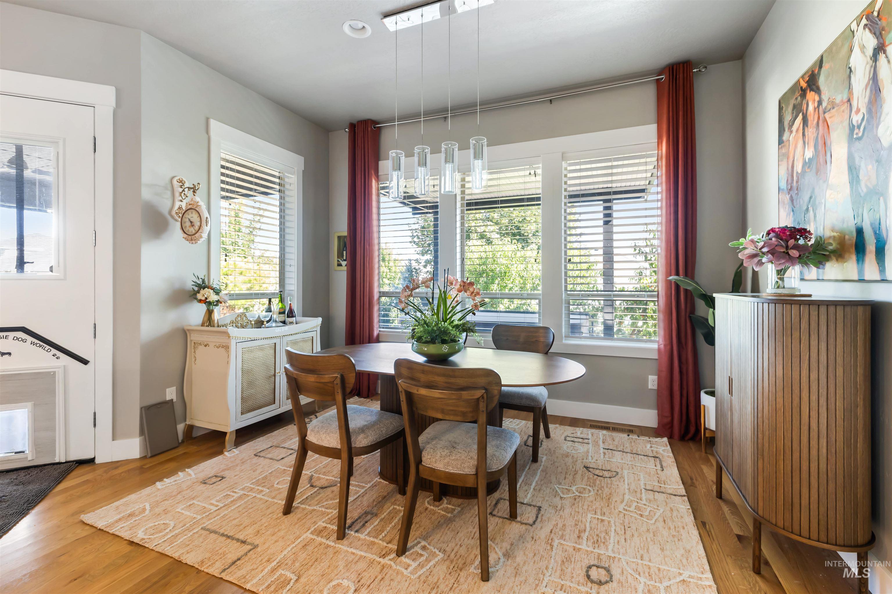 Dining space featuring light wood finished floors and baseboards