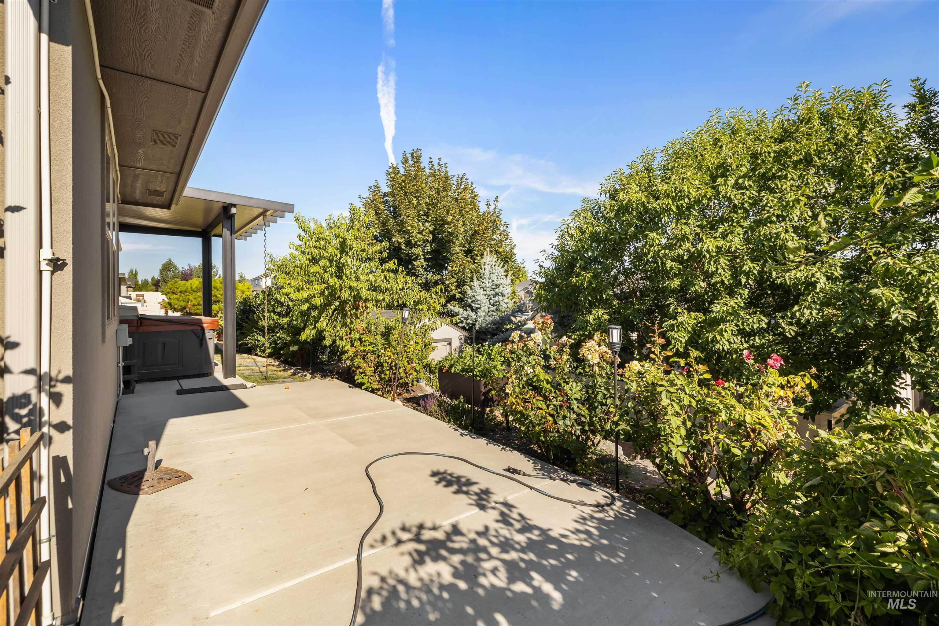 View of patio / terrace with a hot tub