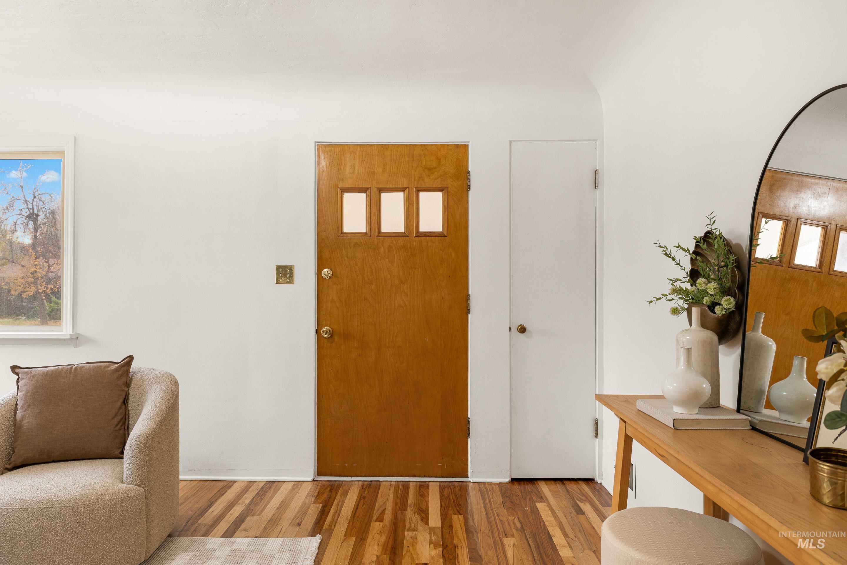 Foyer entrance featuring wood finished floors