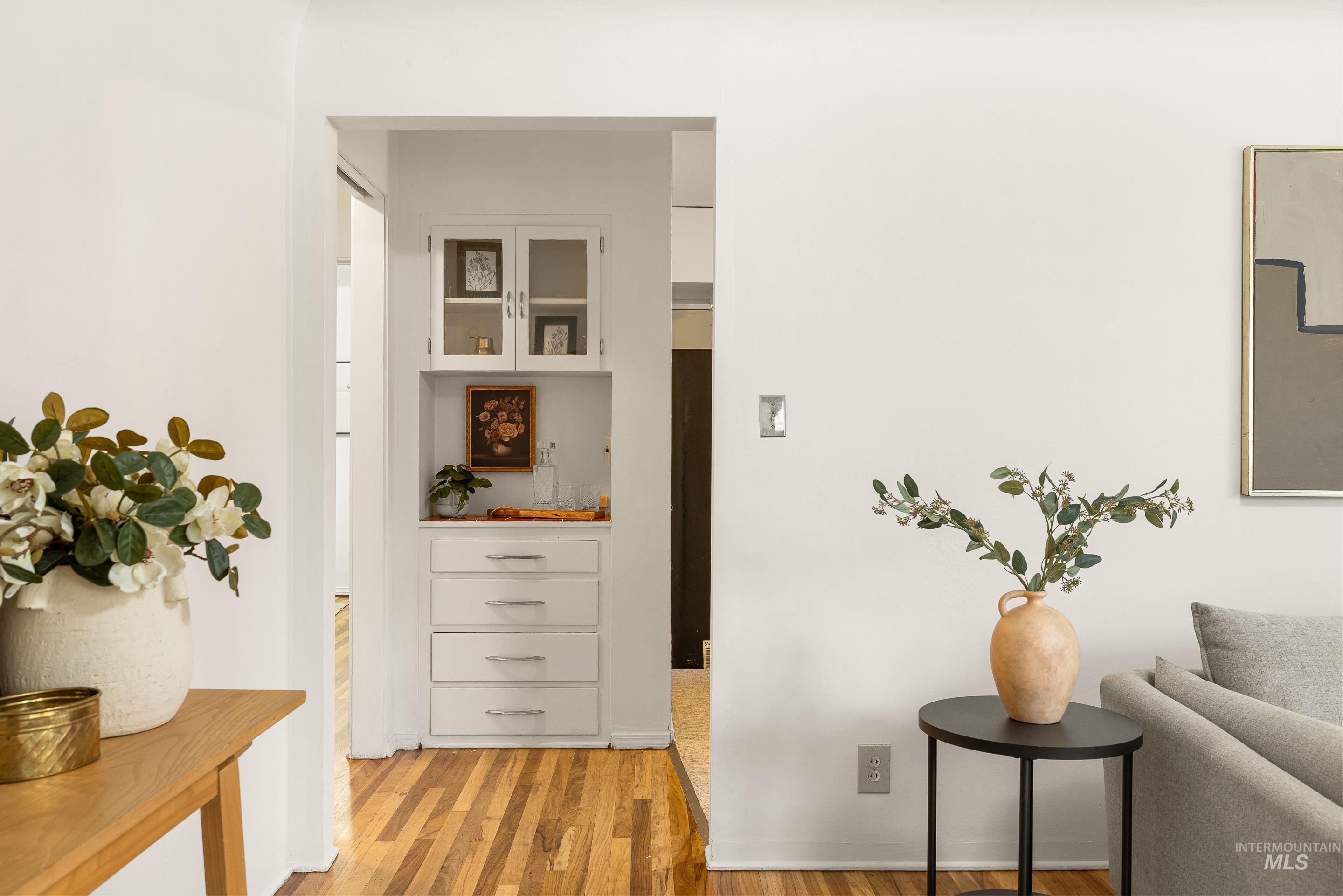 Hall featuring light wood-style floors