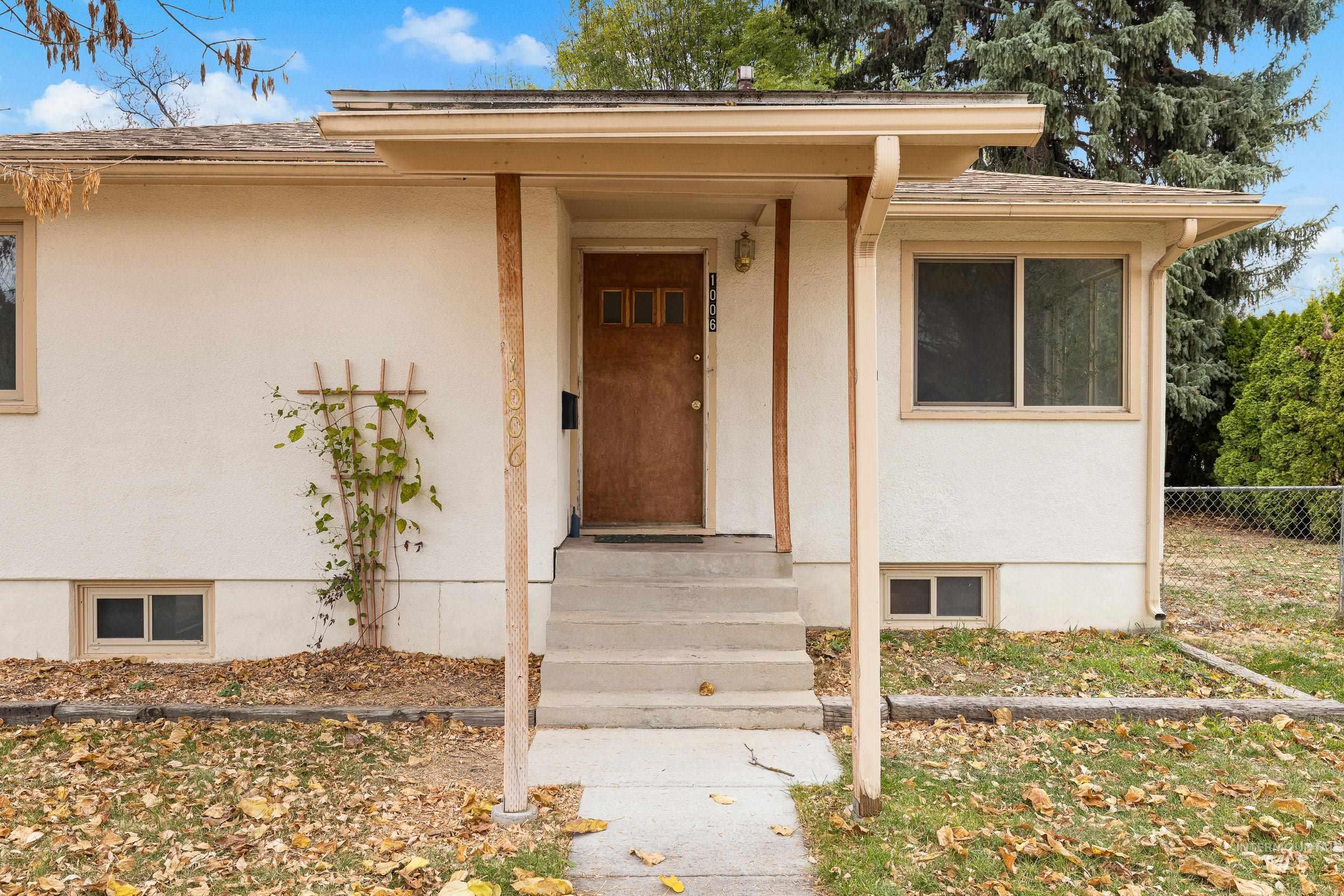 Property entrance with stucco siding