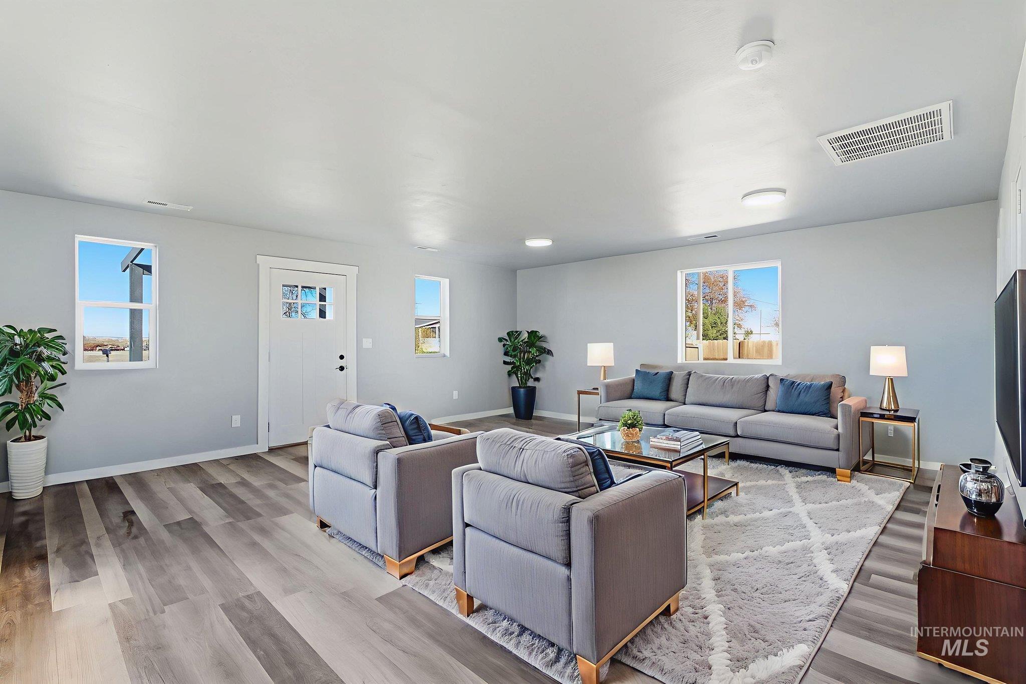 Living area featuring wood finished floors and baseboards