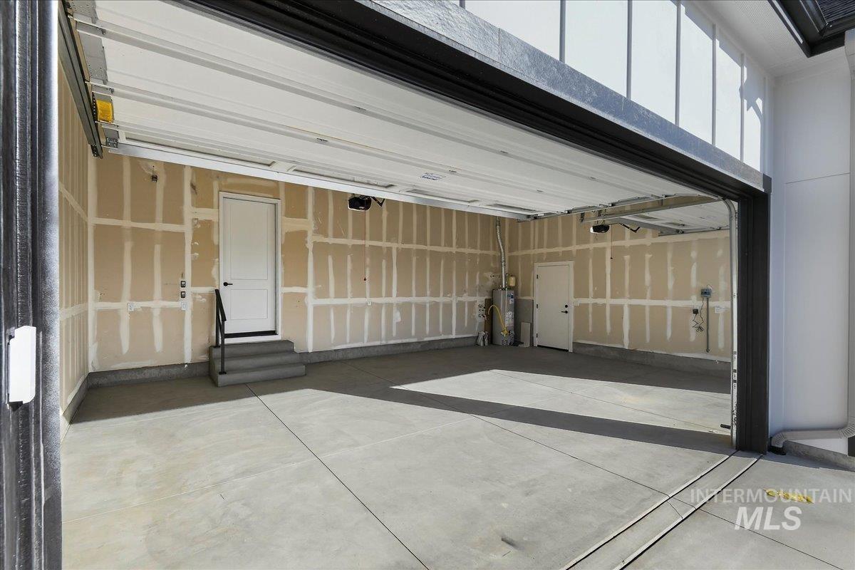 Garage featuring water heater