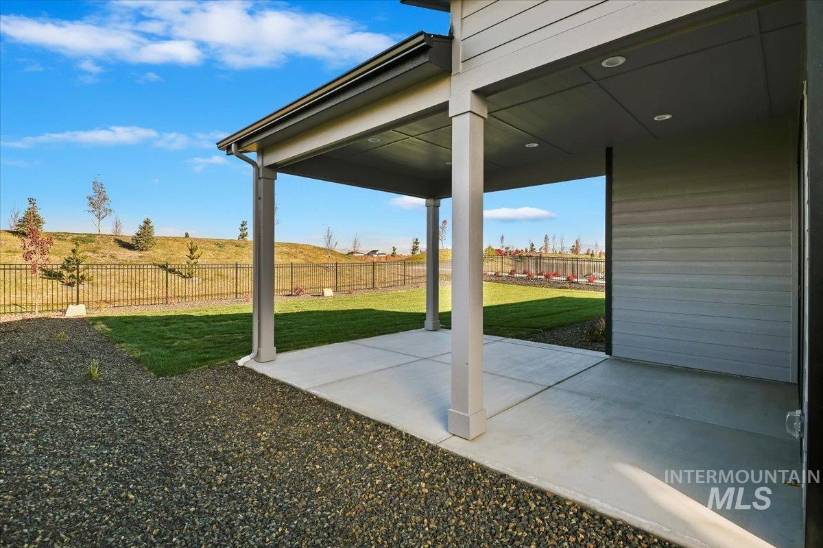 Fenced backyard featuring a patio area