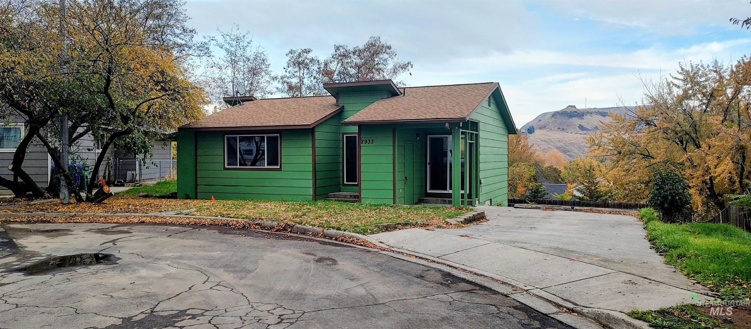 View of front of property with roof with shingles