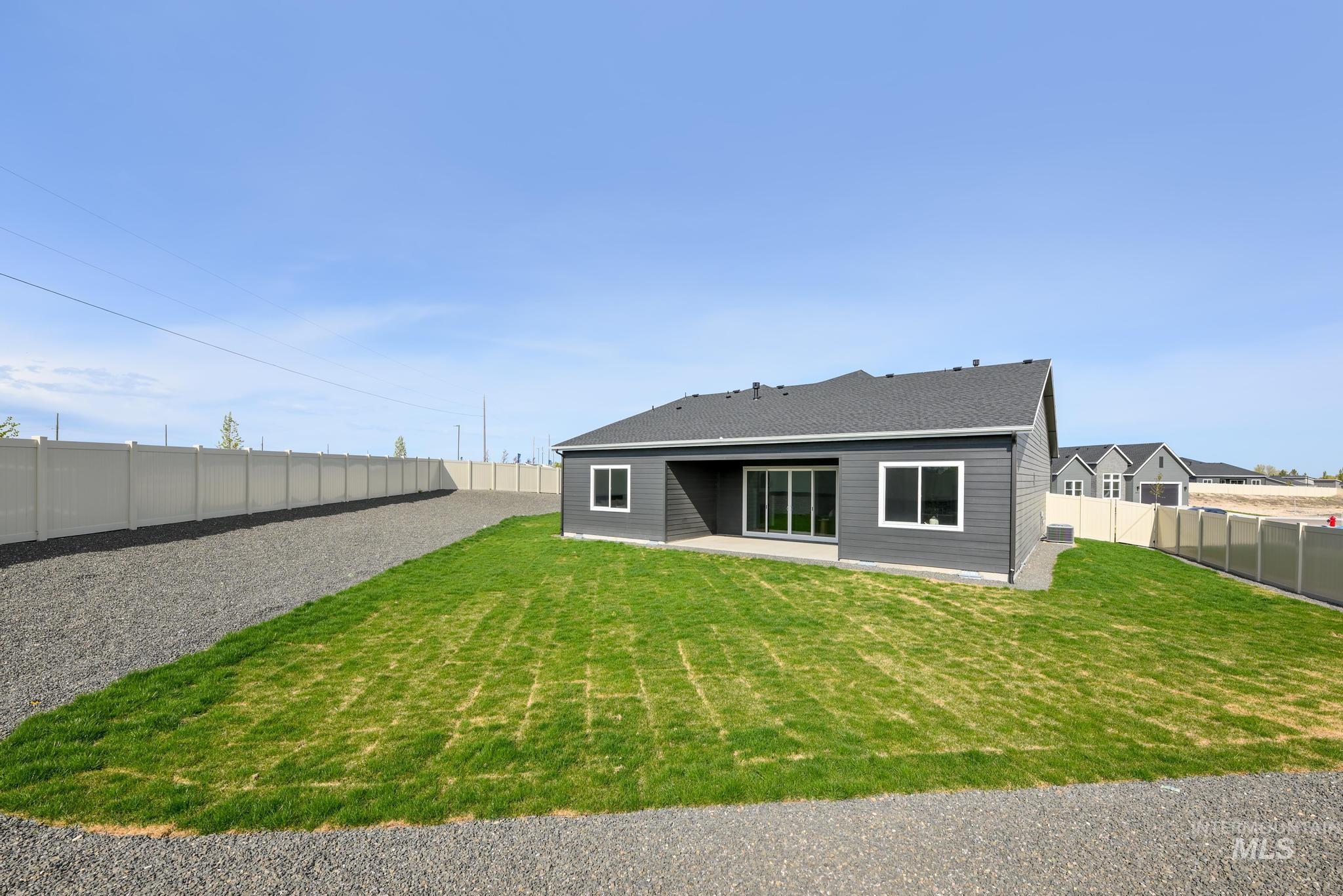 Back of house featuring a fenced backyard