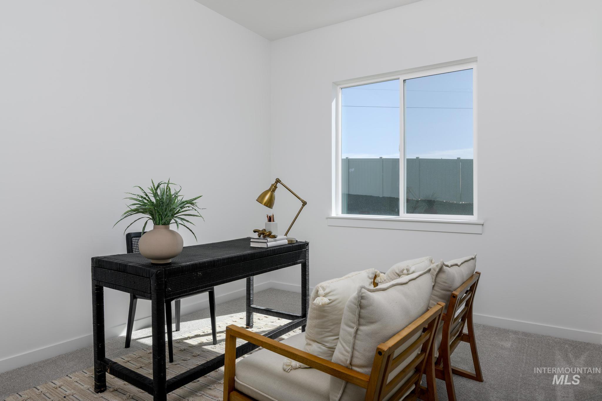 Office area featuring carpet flooring and baseboards