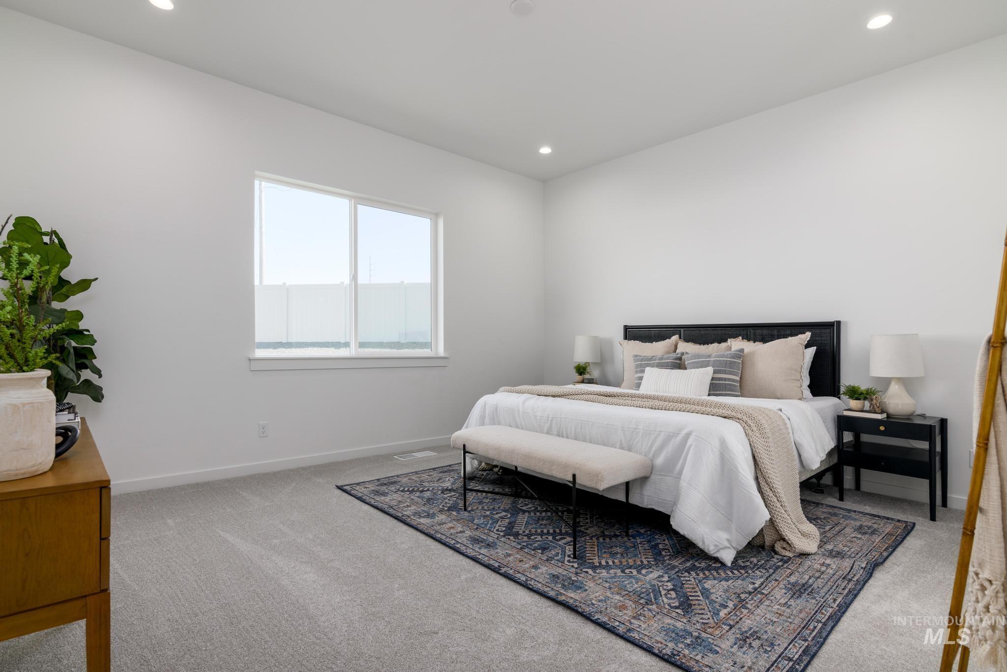 Carpeted bedroom featuring recessed lighting