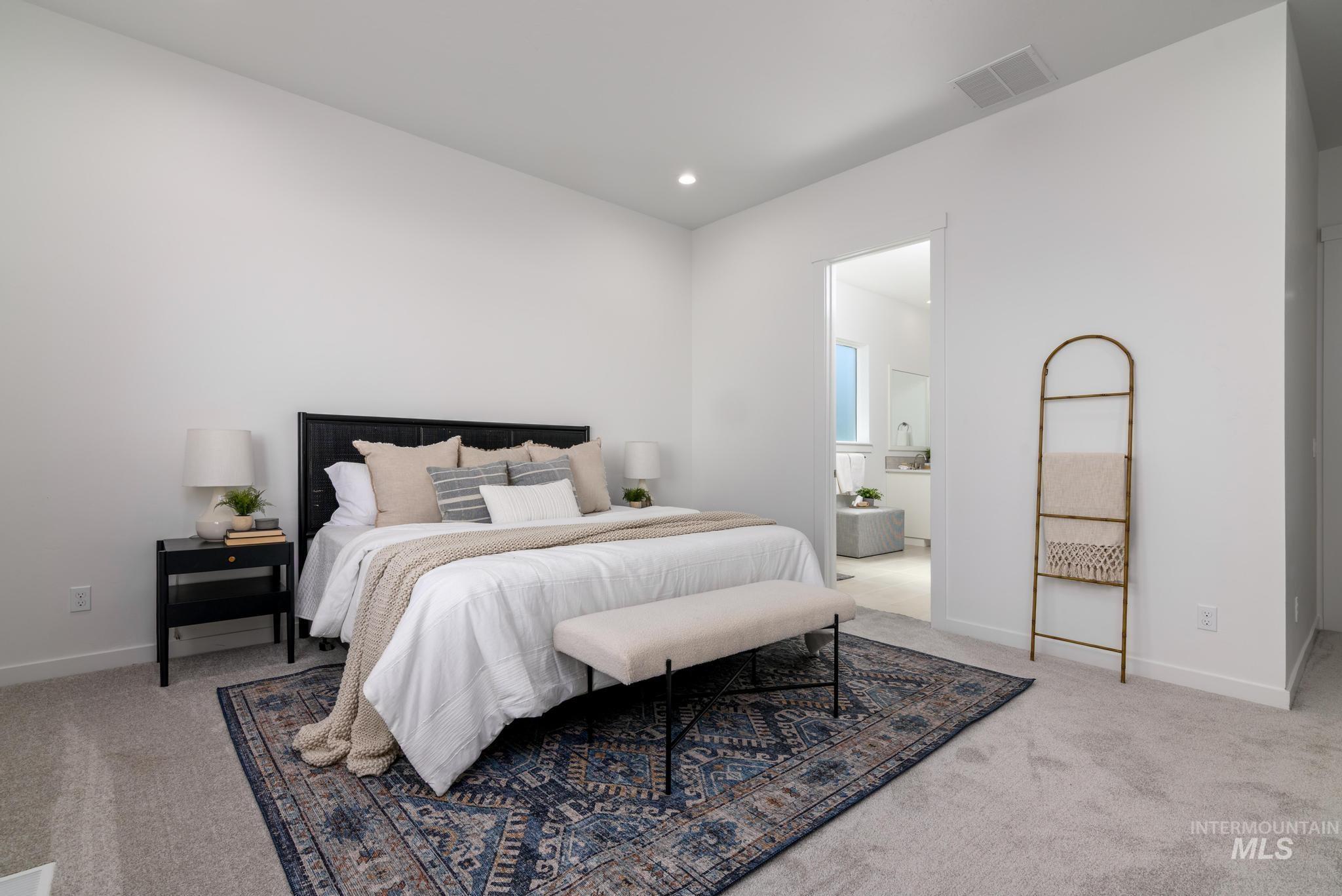 Bedroom with carpet floors and recessed lighting