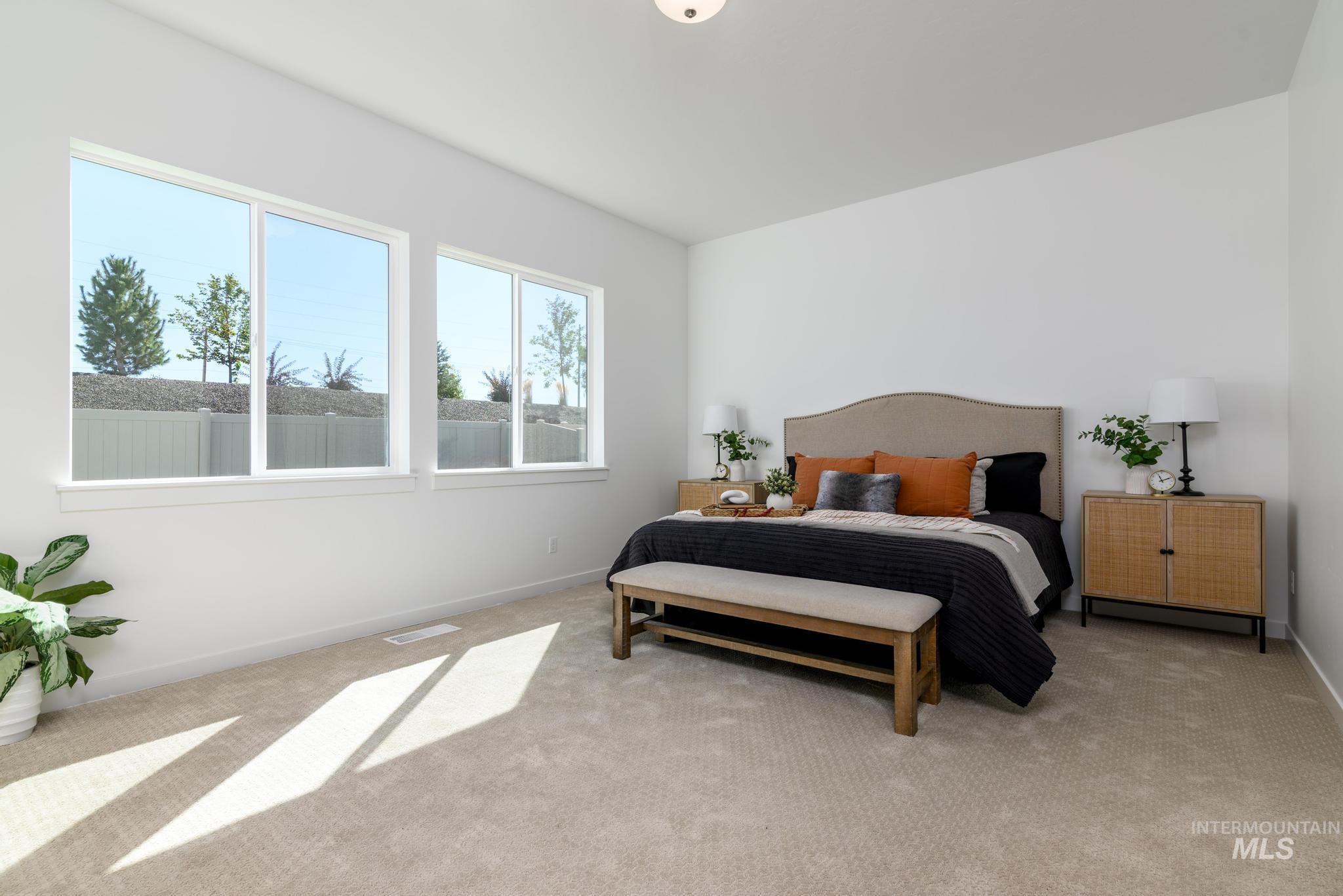Carpeted bedroom with baseboards