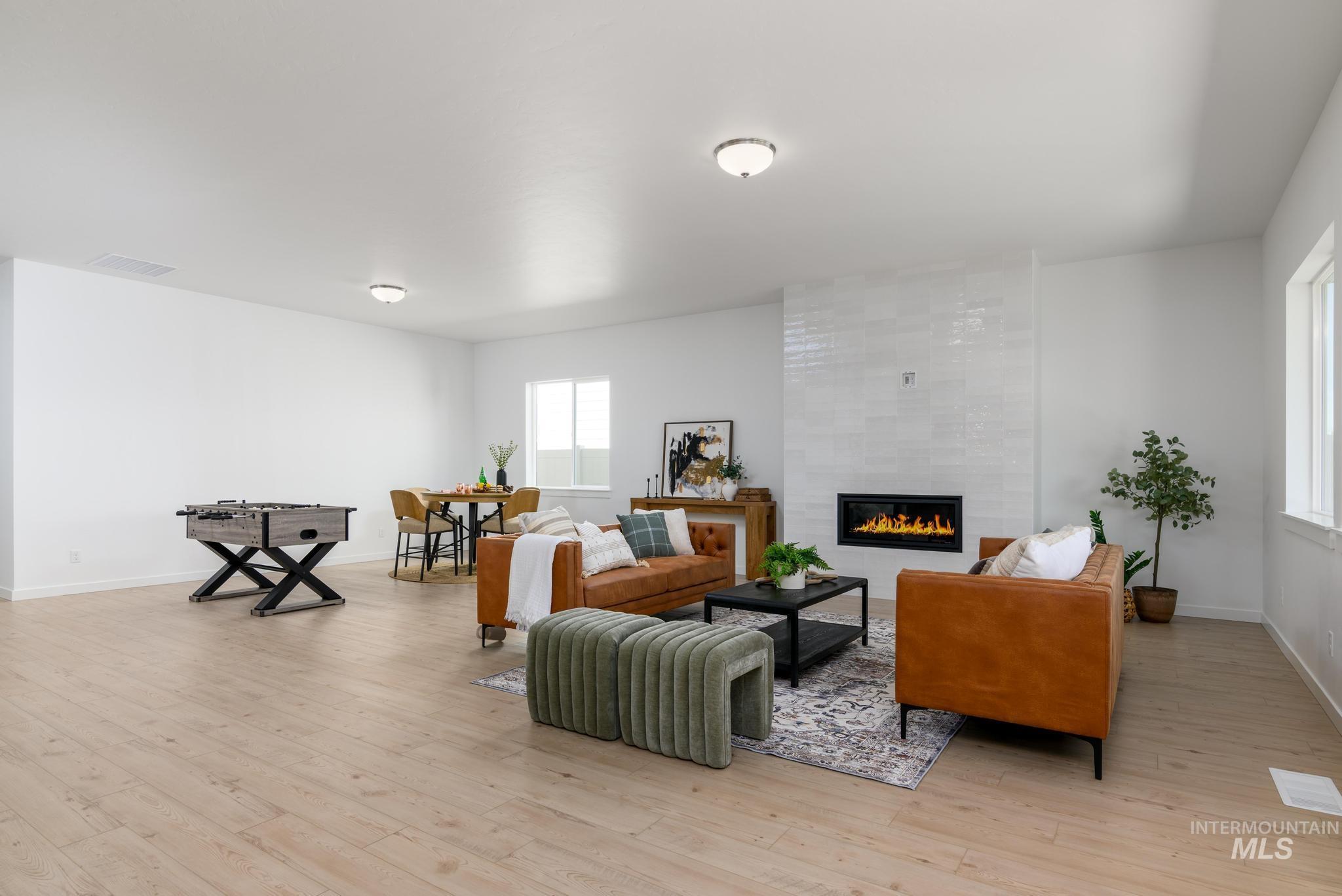 Living area featuring a fireplace and light wood-style floors