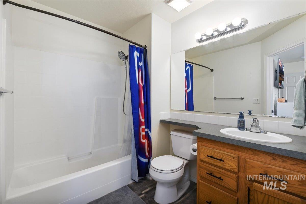 Bathroom featuring vanity and shower / bath combo