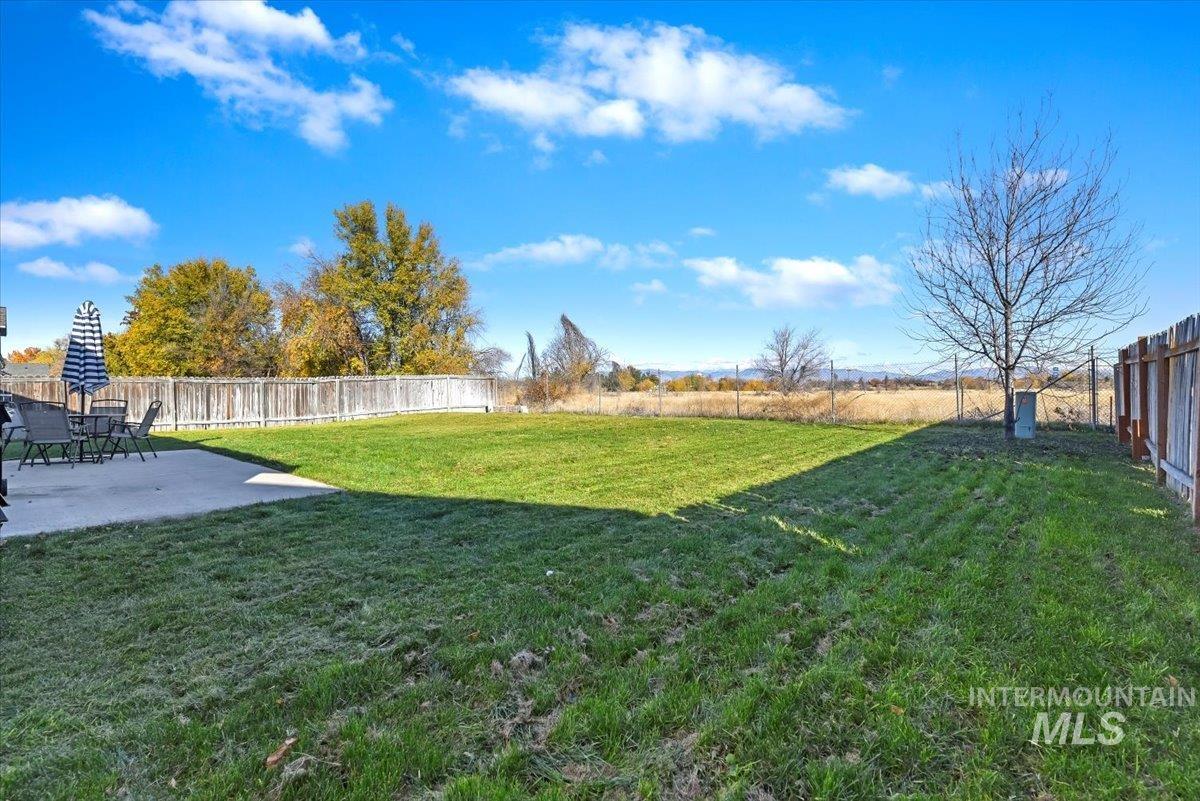 Fenced backyard featuring a patio area