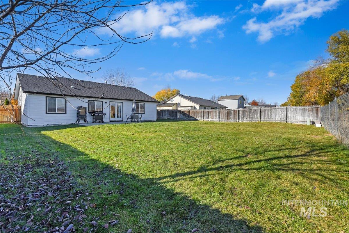Back of house featuring a fenced backyard and a patio area