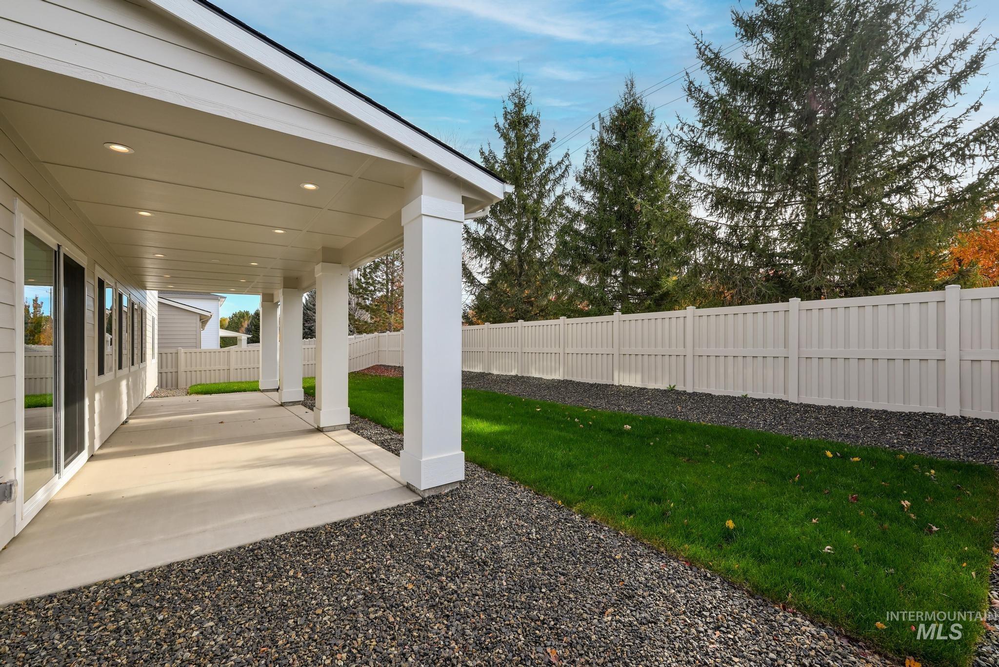 Fenced backyard featuring a patio area