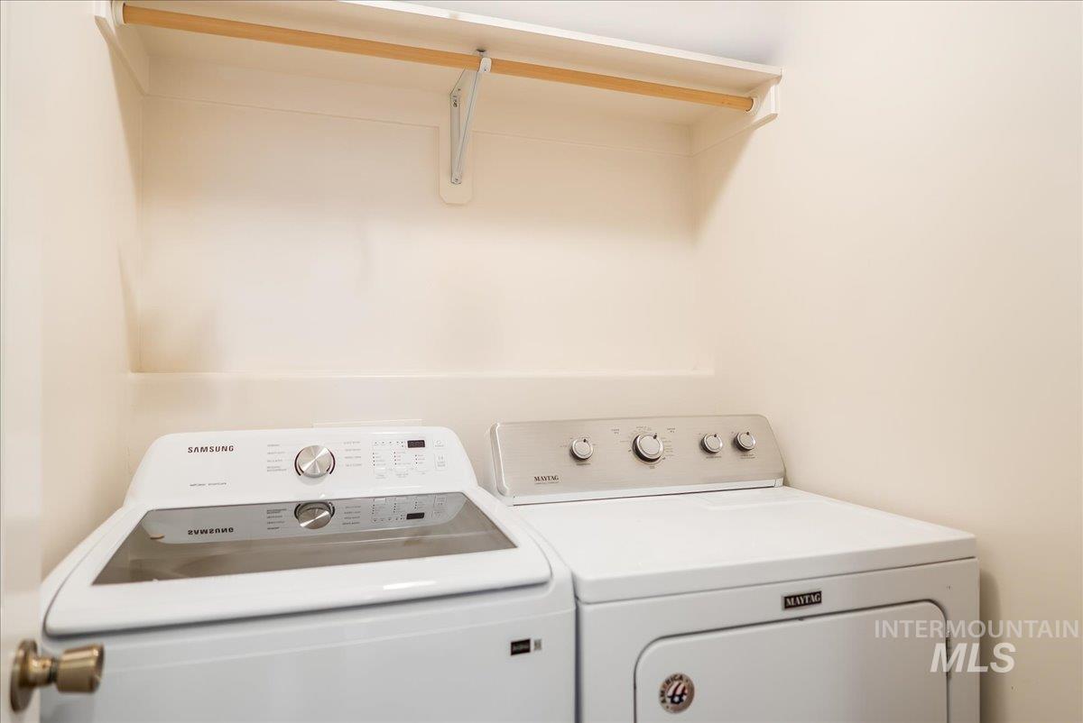 Laundry area featuring separate washer and dryer