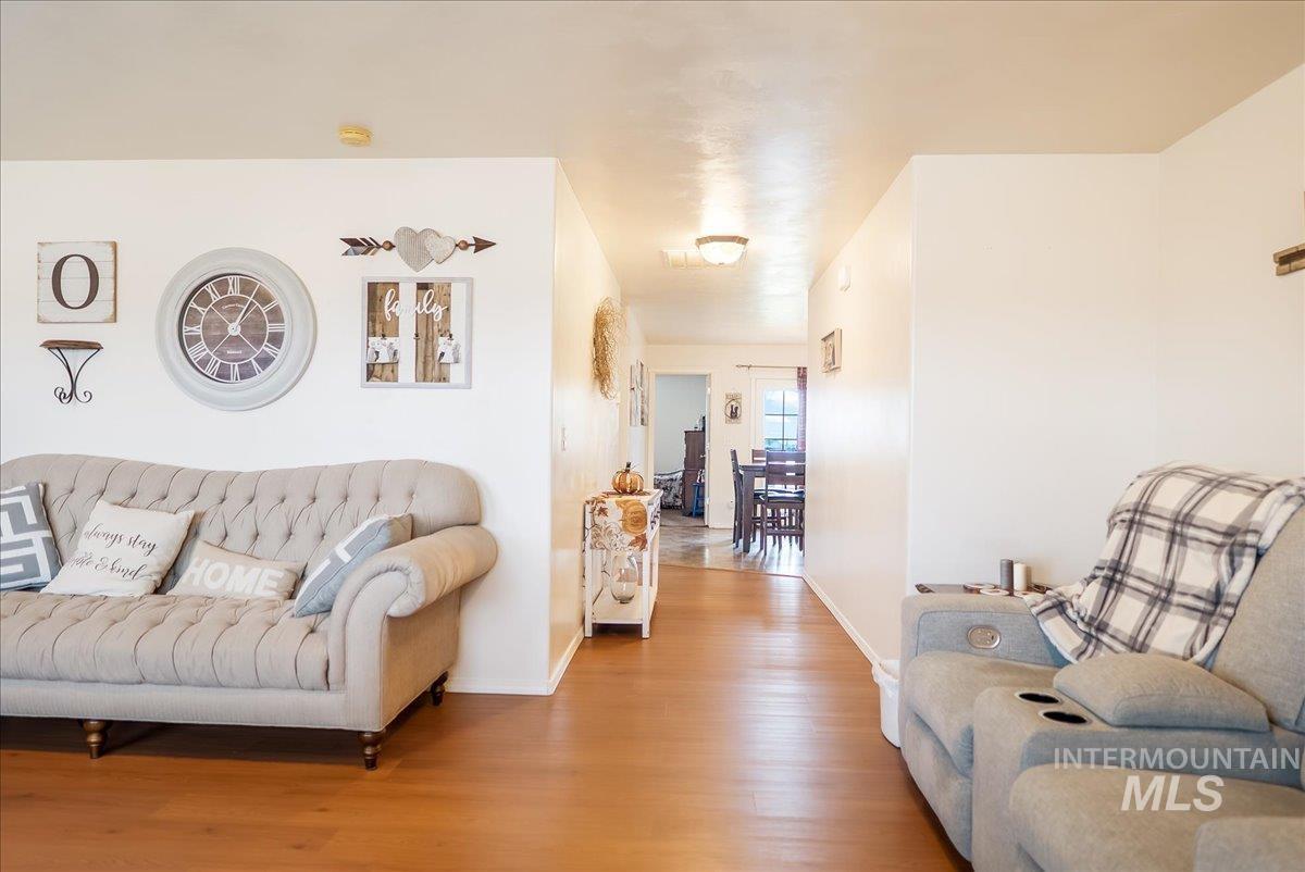 Living area featuring wood finished floors and baseboards