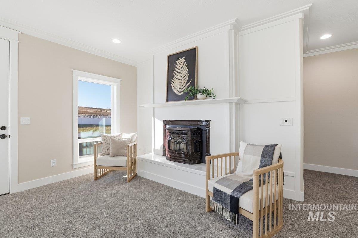 Sitting room featuring crown molding, carpet floors, and recessed lighting, Pellet Stove