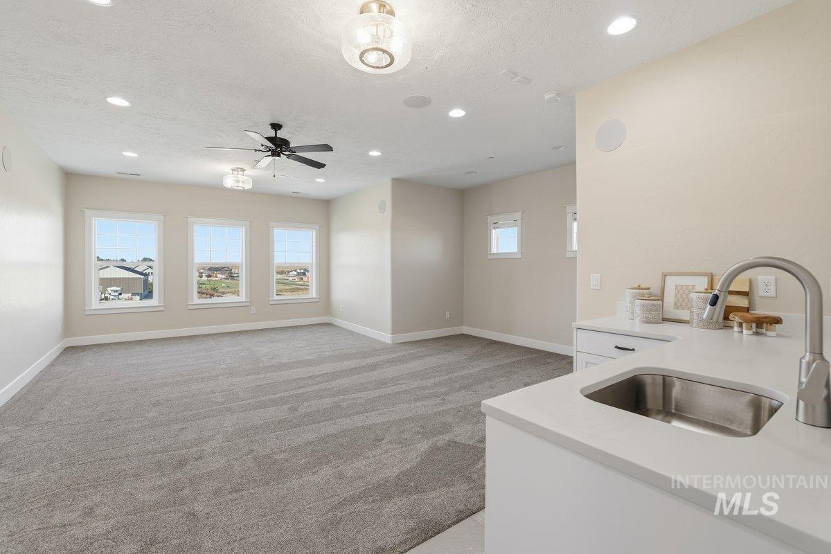 Kitchenette with sink and beverage refrigerator
