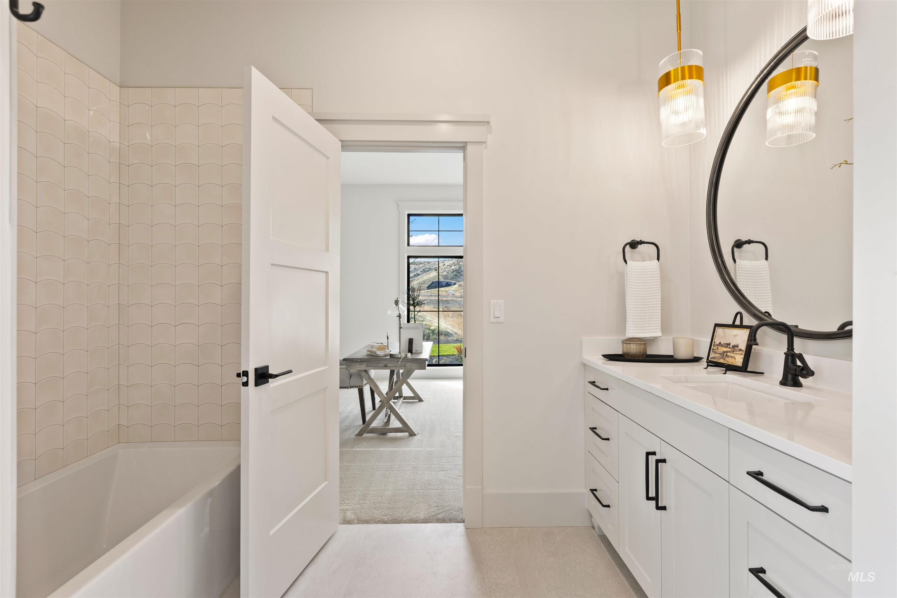 Full bathroom featuring light carpet, vanity, bathing tub / shower combination, and light tile patterned floors