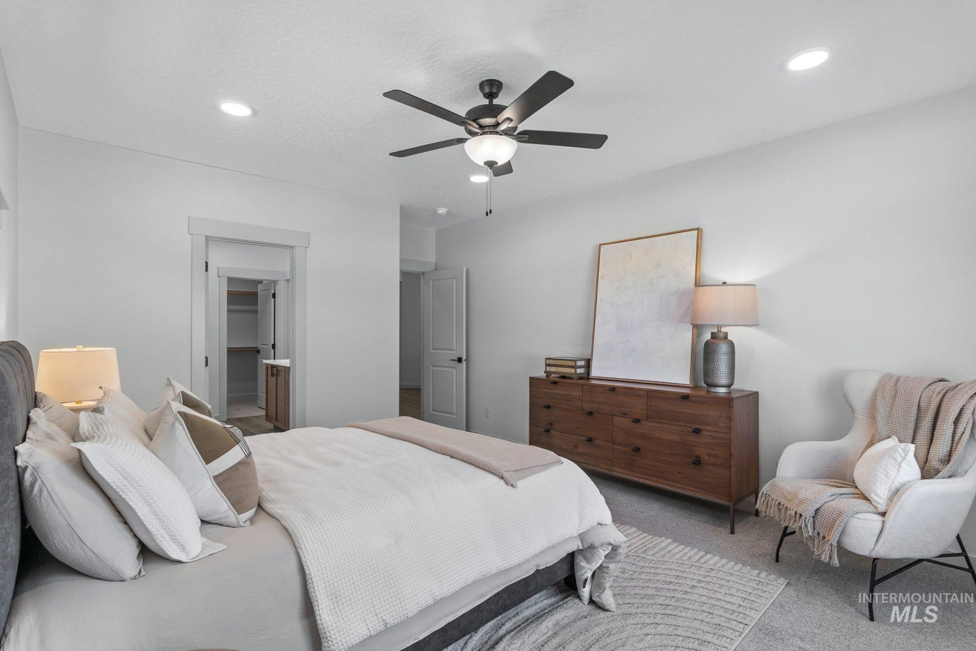 Bedroom with carpet floors, a ceiling fan, and recessed lighting