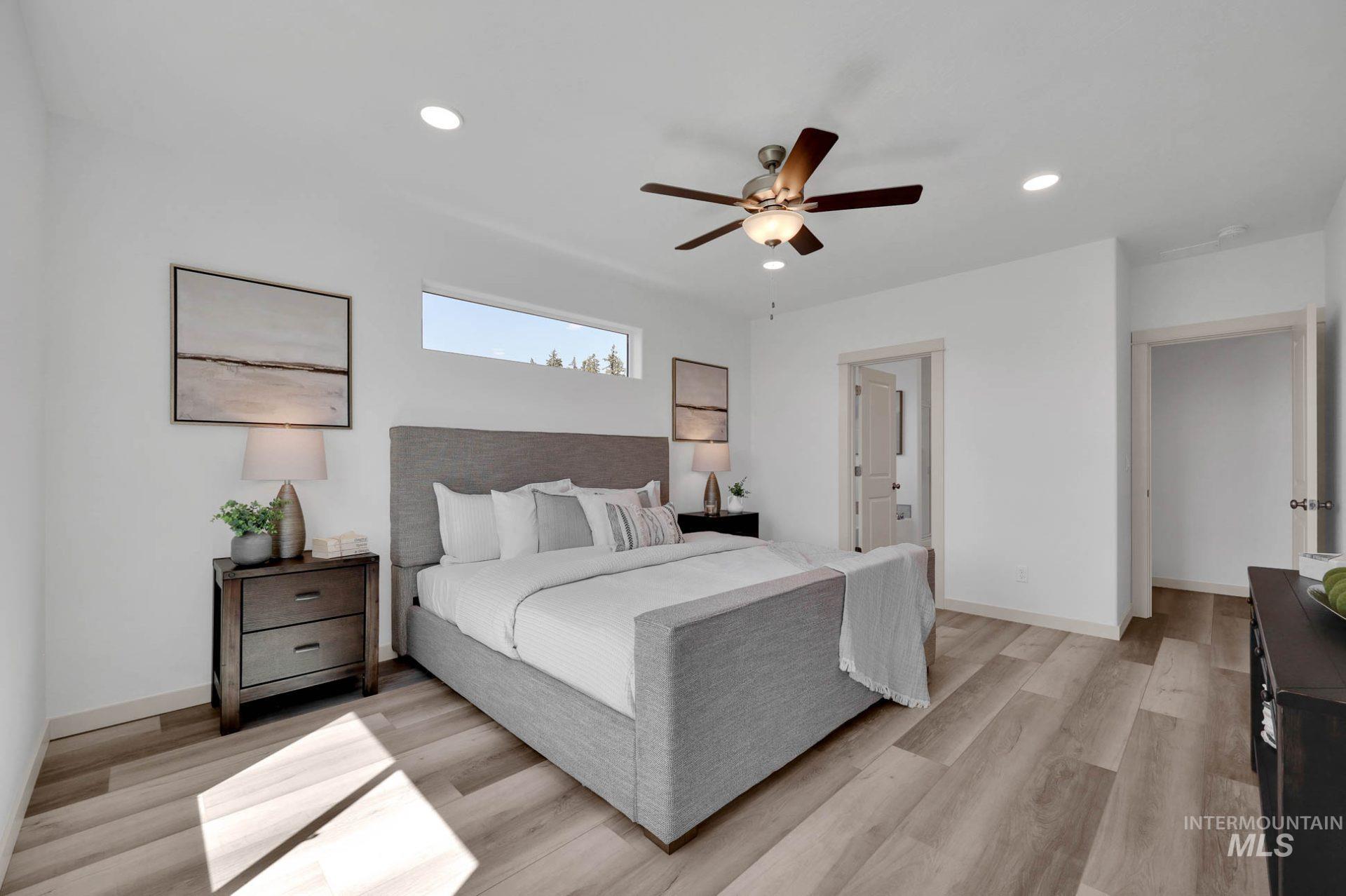 Bedroom with recessed lighting, ceiling fan, and light wood finished floors
