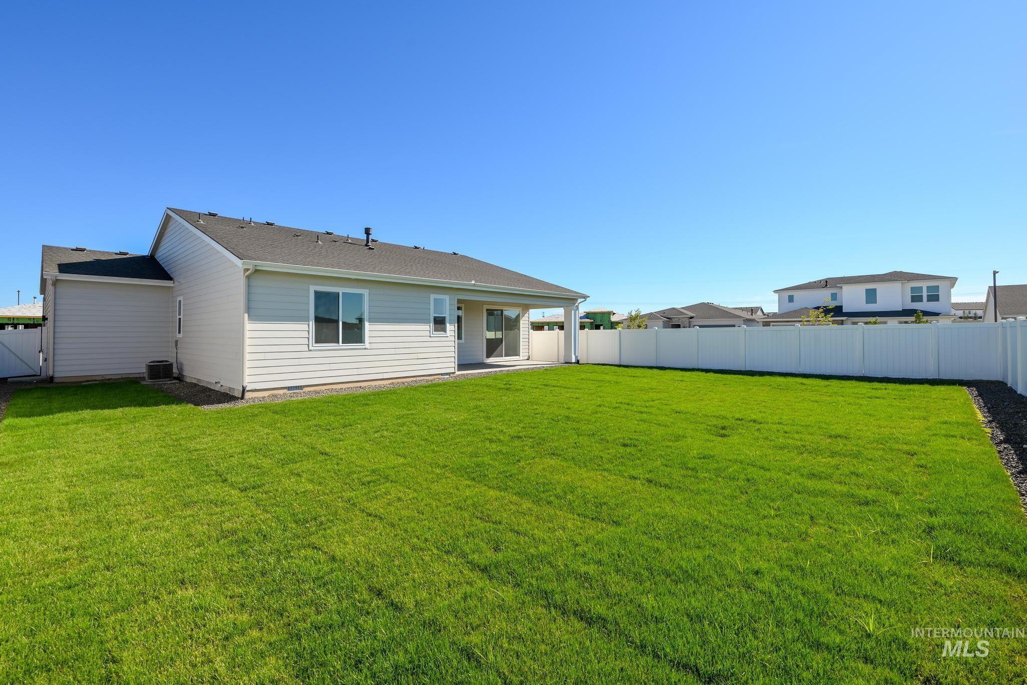 Back of property featuring a patio area and a fenced backyard