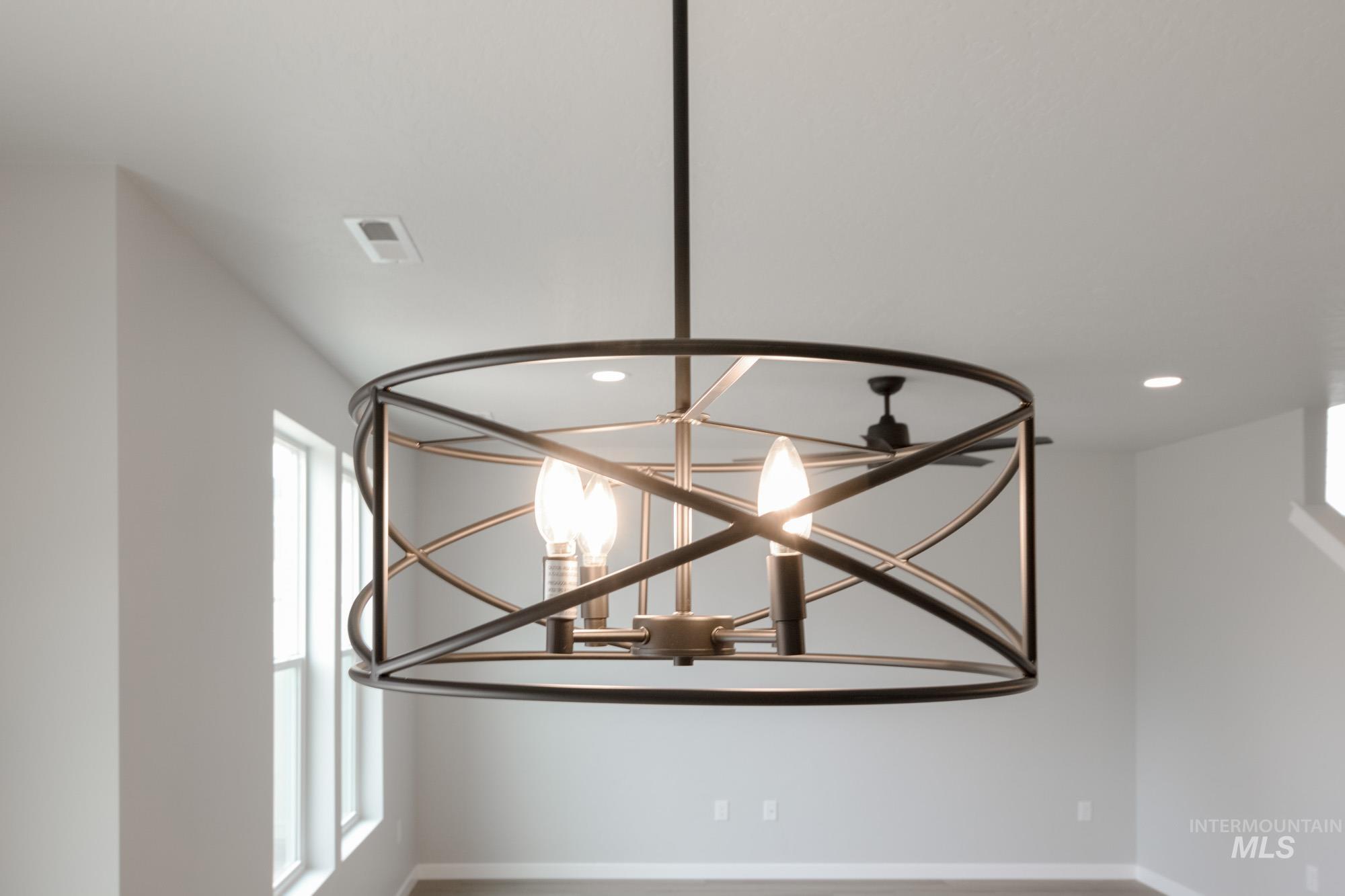 Detailed view of a chandelier and recessed lighting