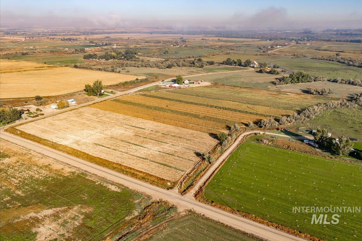 Aerial overview of property's location with rural landscape and extensive farmland