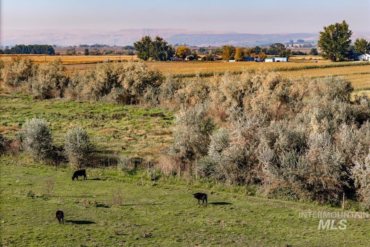 View of mountain background with rural landscape and agricultural land