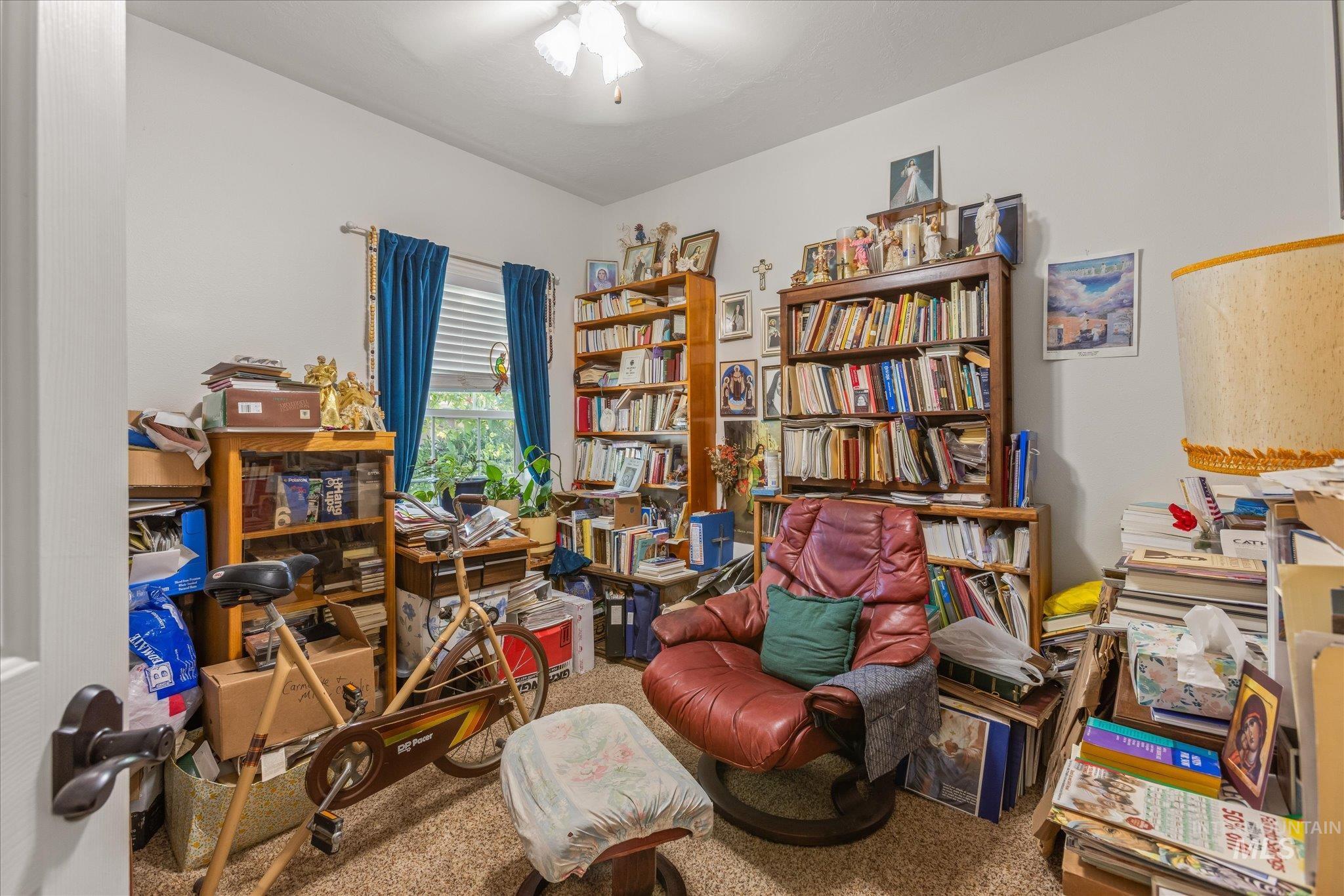 Sitting room featuring carpet floors and ceiling fan