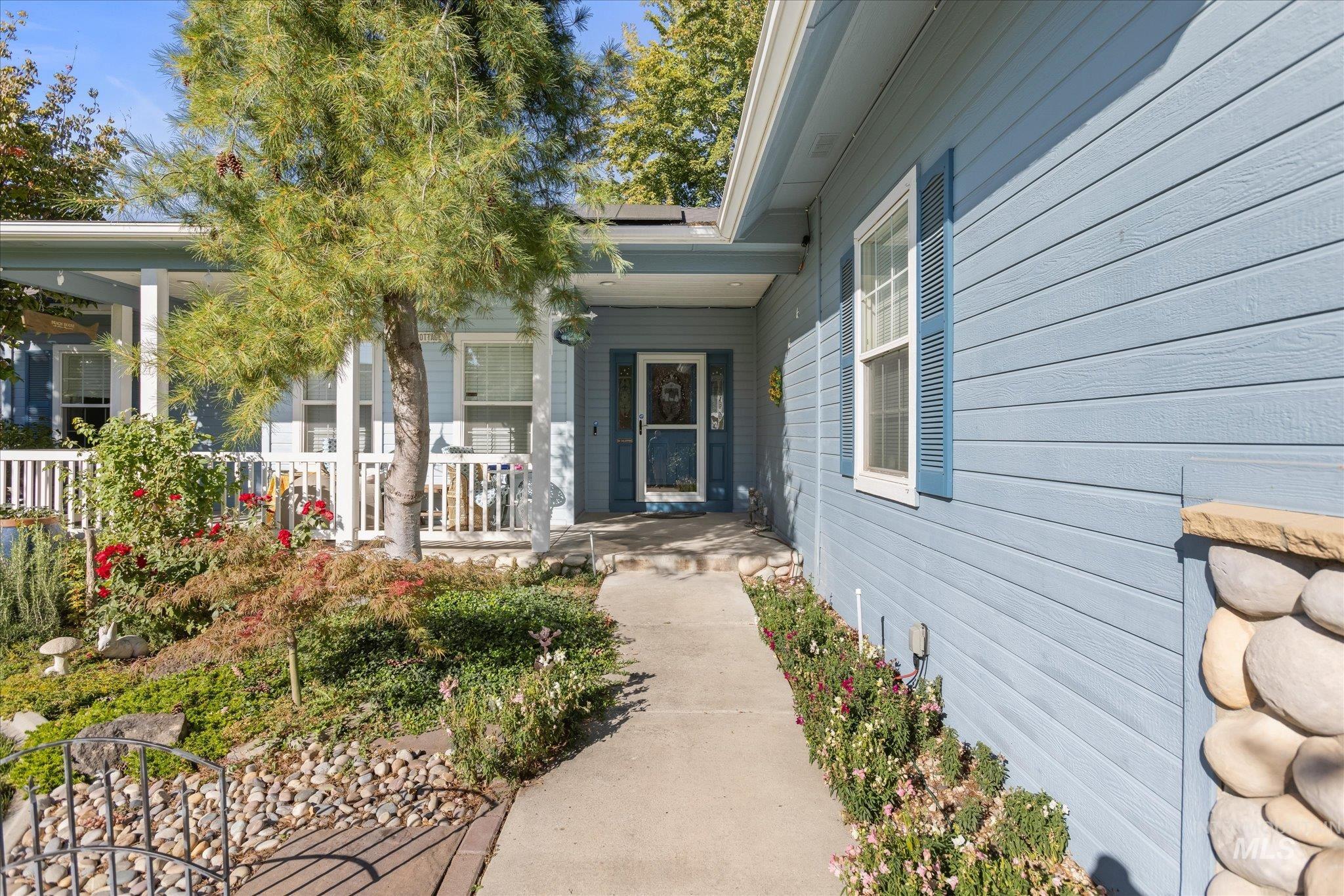 Entrance to property featuring covered porch