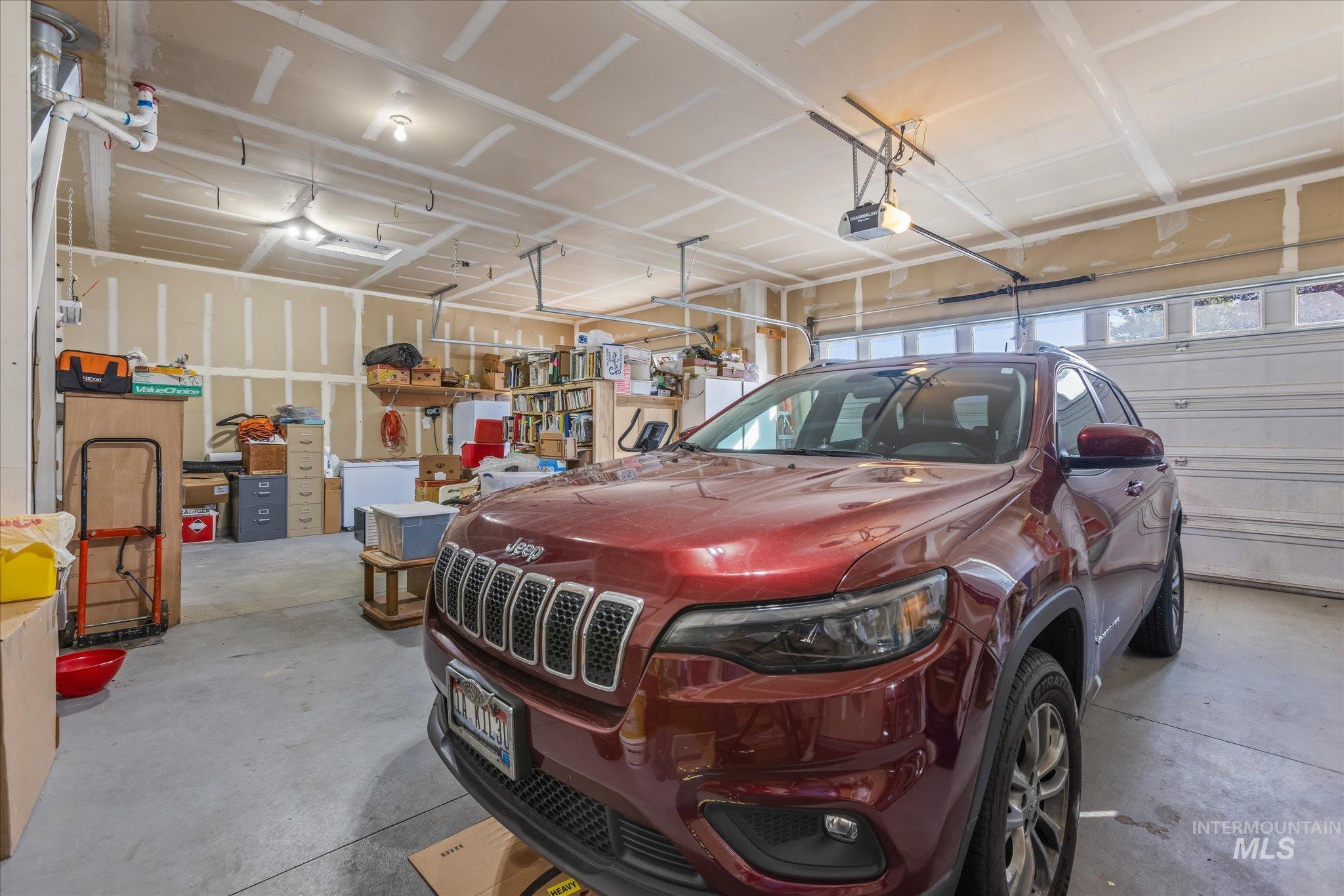 Garage featuring a garage door opener