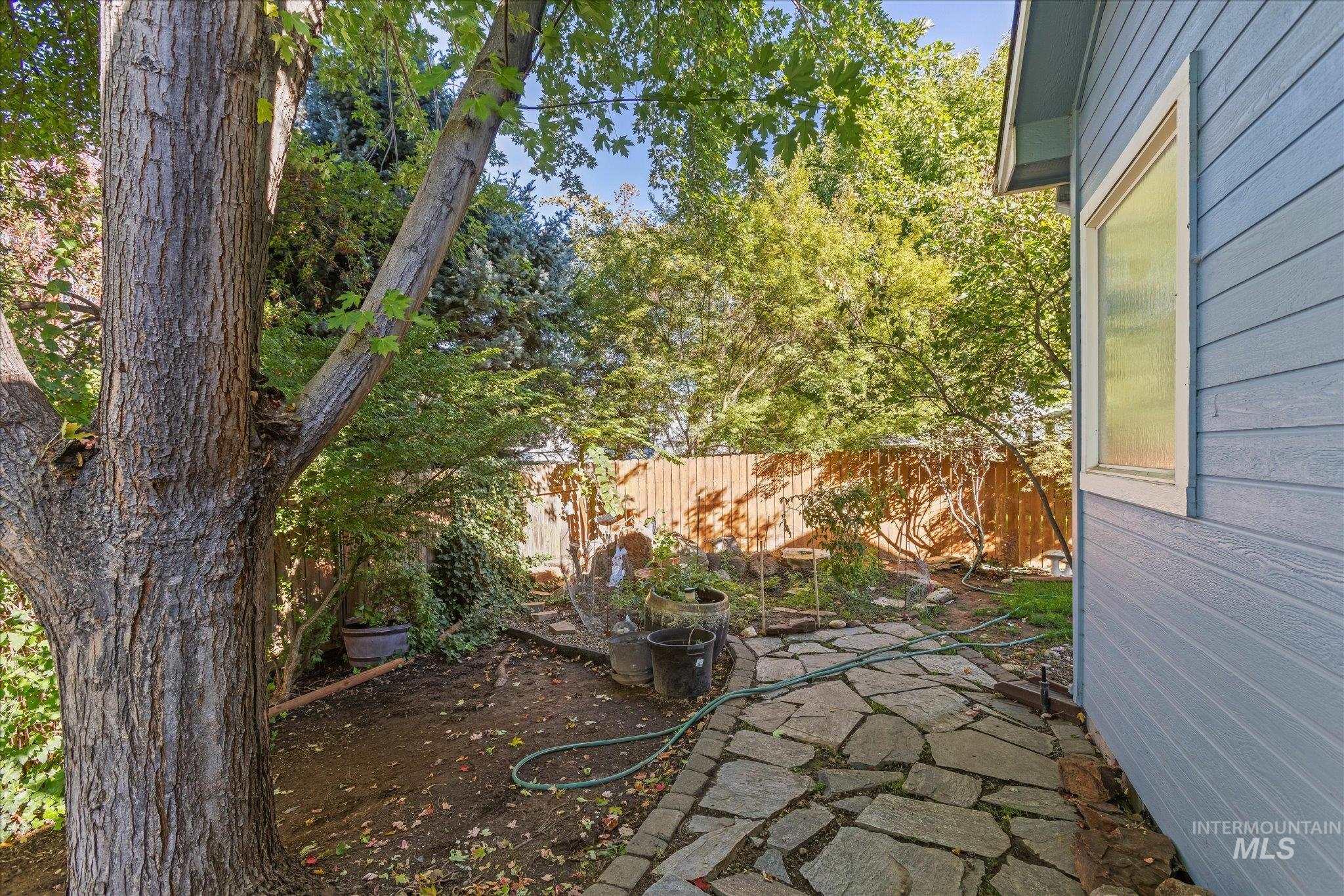View of yard with a patio