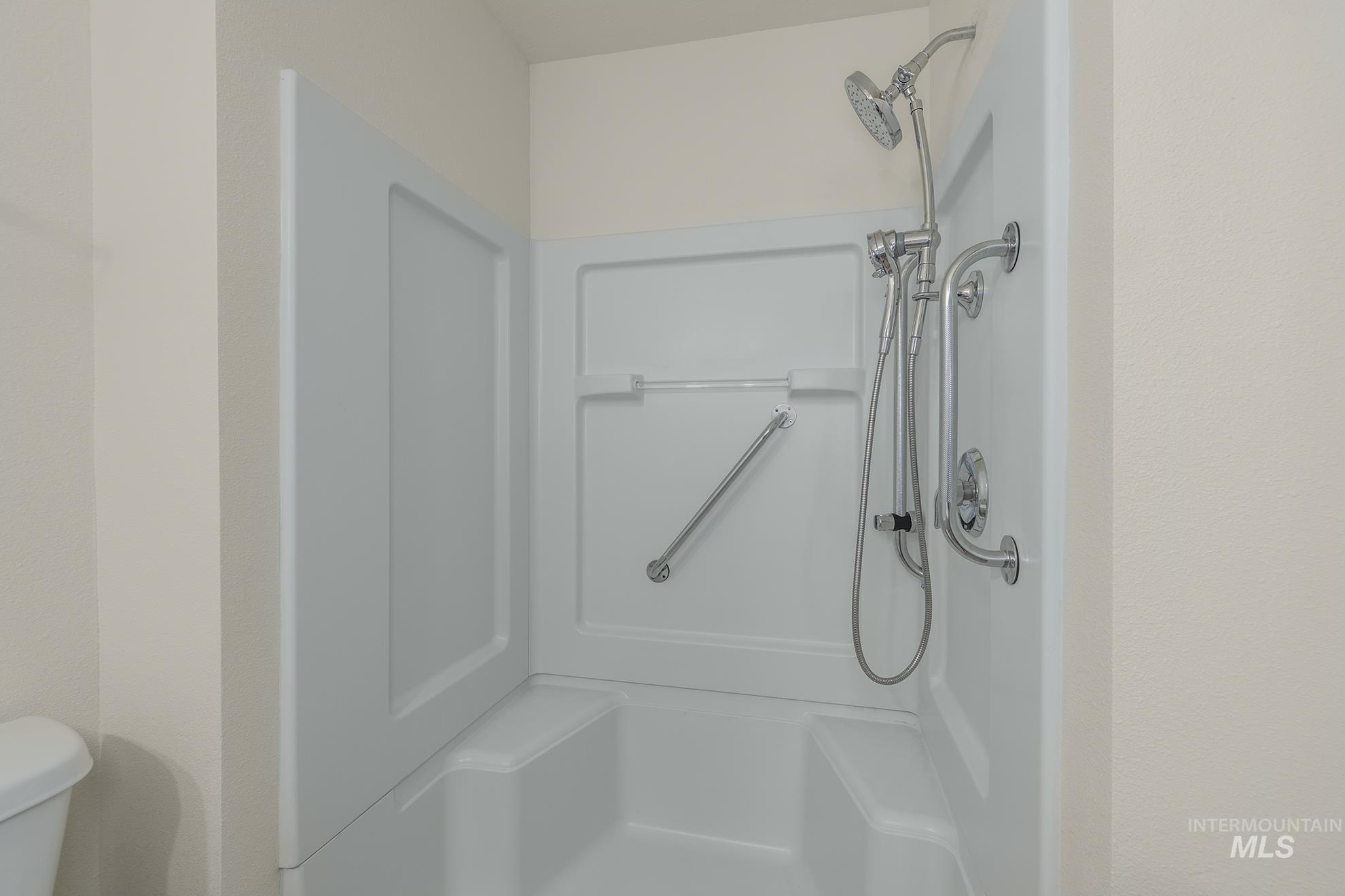 Bathroom with a shower and toilet