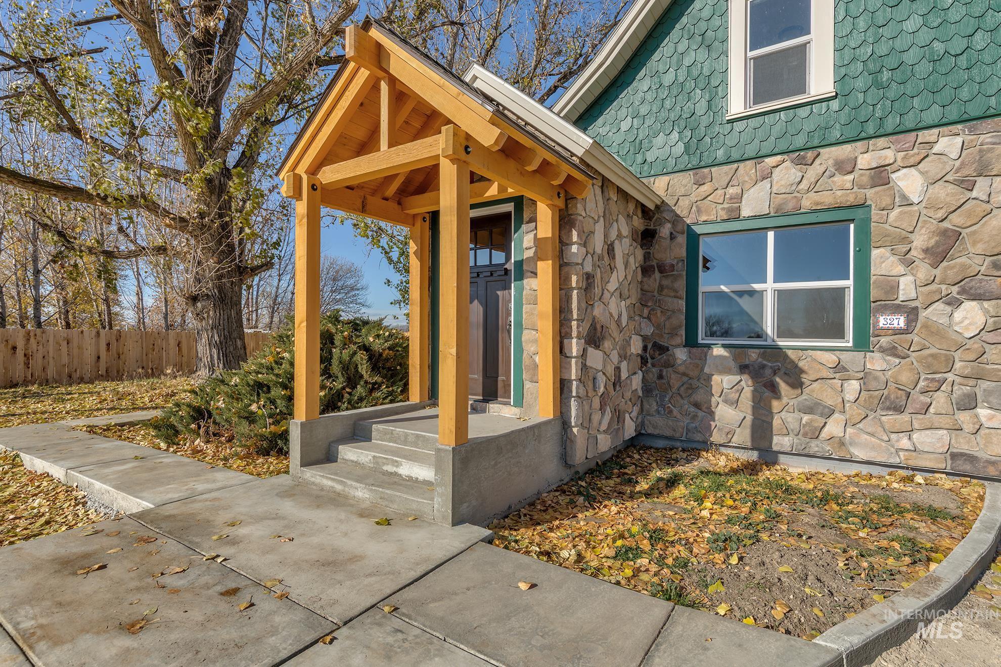 Entrance to property with stone siding