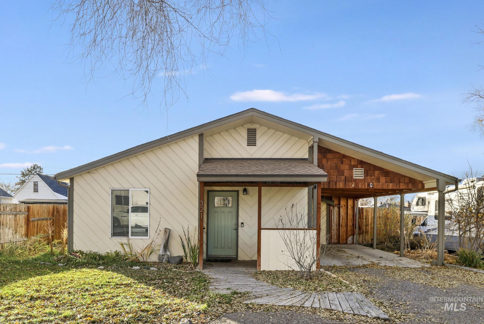 View of front of property featuring roof with shingles