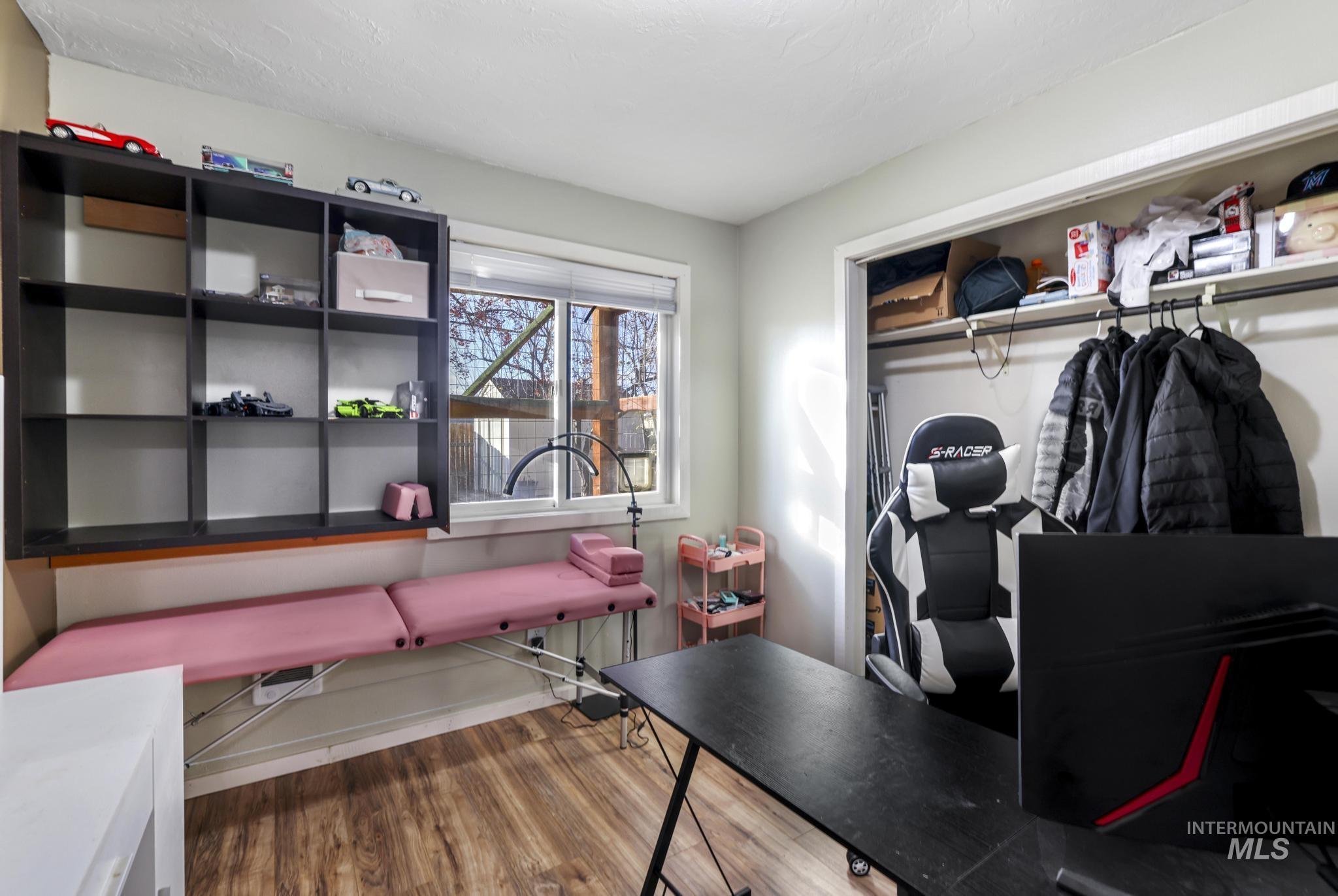 Office area with wood finished floors and baseboards
