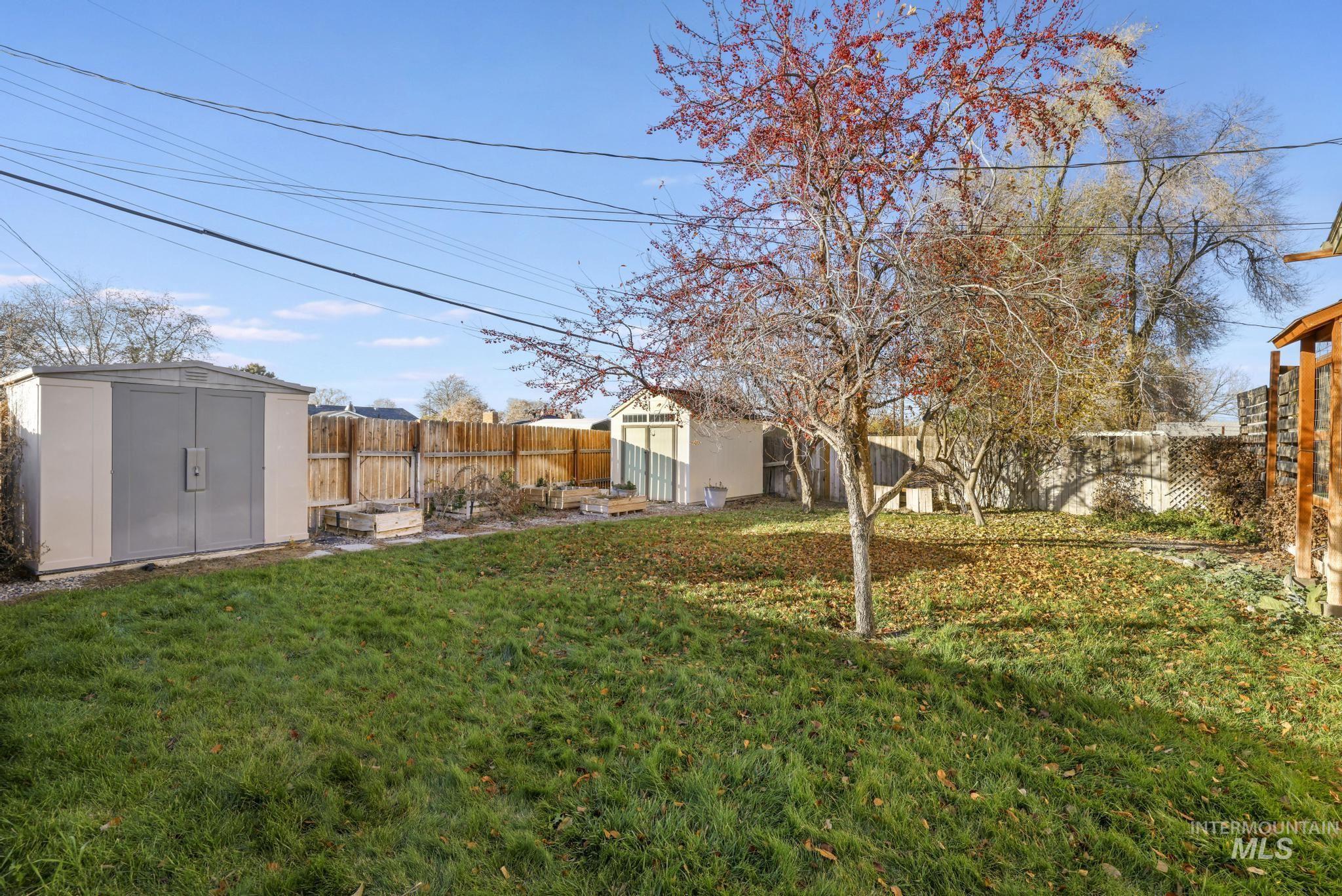 Fenced backyard with a shed